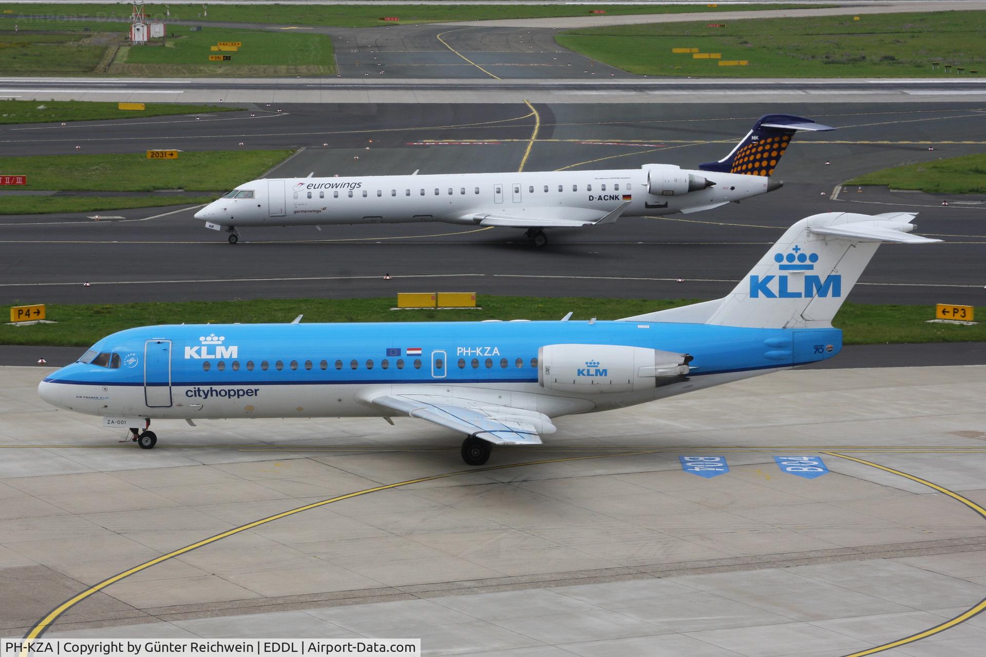 PH-KZA, 1996 Fokker 70 (F-28-070) C/N 11567, PH-KZA on apron with D-ACNK taxiing
