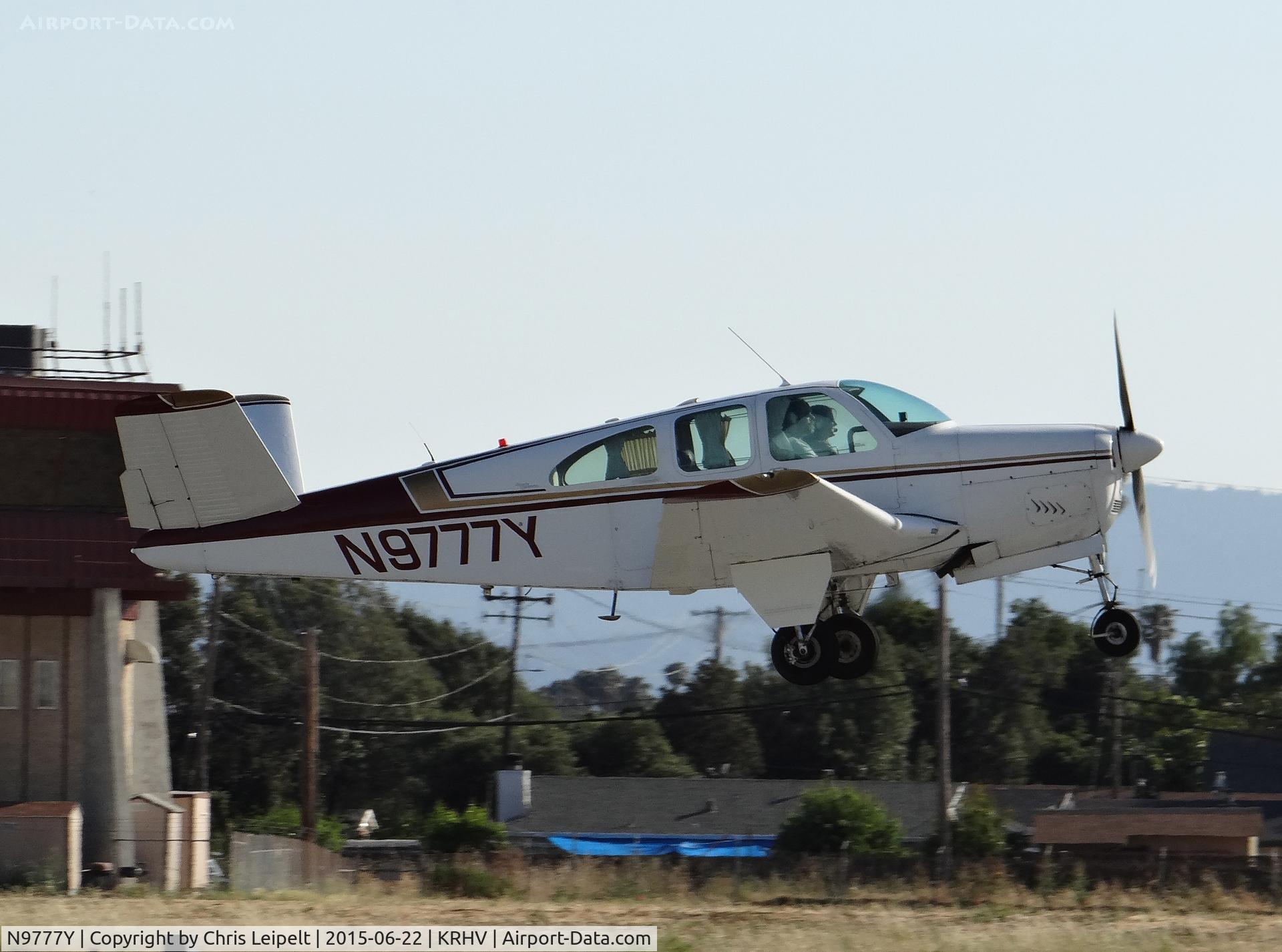 N9777Y, 1963 Beech P35 Bonanza C/N D-7160, Locally-based 1963 Beechcraft P35 Bonanza departing runway 31R at Reid Hillview Airport, San Jose, CA.