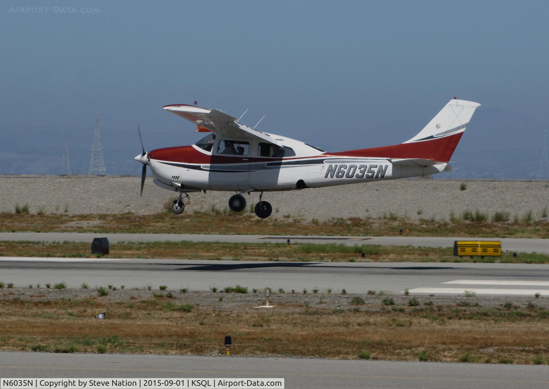N6035N, 1978 Cessna 210M Centurion C/N 21062903, 1978 Cessna 210M in new colors making crosswind landing @ San Carlos Airport, CA