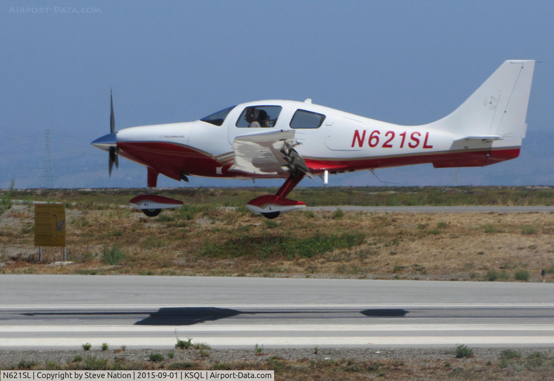 N621SL, 2005 Lancair LC41-550FG C/N 41510, Palo Alto-based 2005 Lancair LC41-550FG over the threshold @ nearby San Carlos Airport, CA
