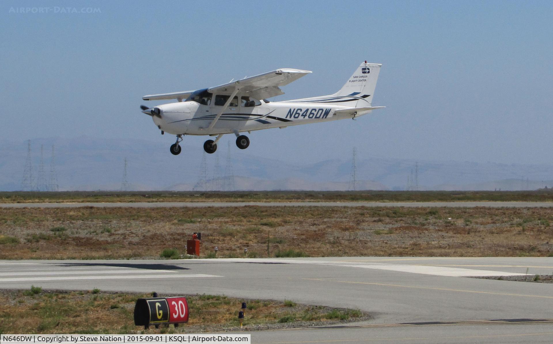 N646DW, 2006 Cessna 172S C/N 172S10141, San Carlos Flight Center 2006 Cessna 172S over threshold @ San Carlos Airport, CA