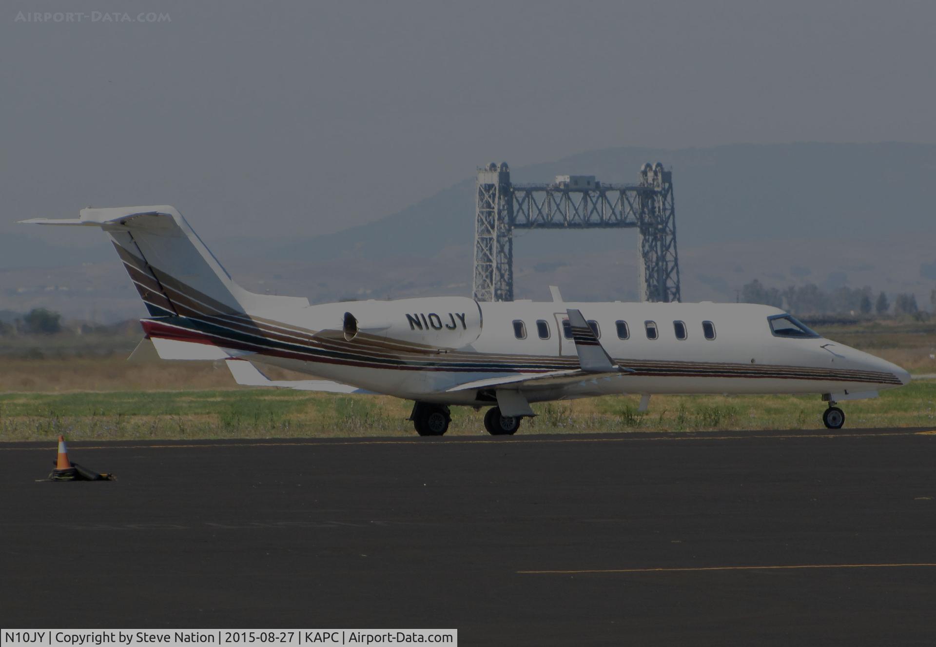 N10JY, 1999 Learjet 45 C/N 063, Millennium Aviation (Rochester, NY) 1999 Learjet 45 taxiing for takeoff @ Napa County Regional Airport, CA - iconic Napa River RR Bridge visible through the heat waves