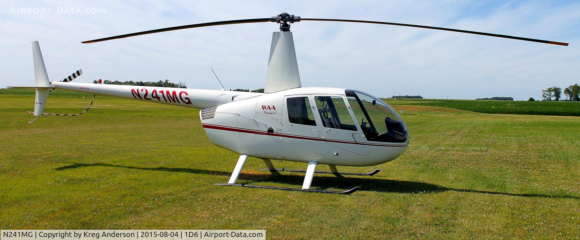 N241MG, 2005 Robinson R44 C/N 1483, Robinson R44 Raven resting in a field in Hector, MN.