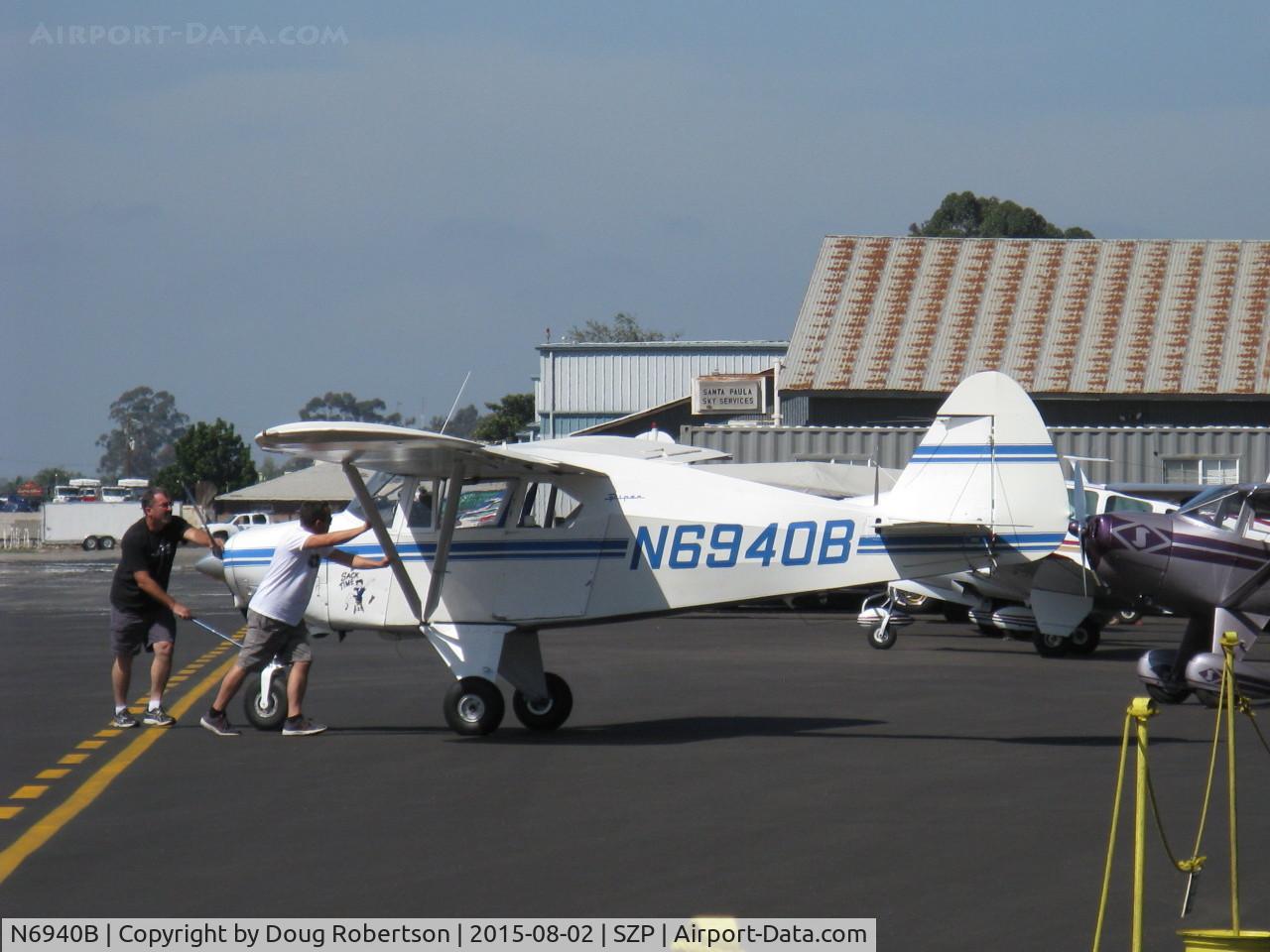 N6940B, 1956 Piper PA-22-150 Tri-Pacer C/N 22-4219, 1956 Piper PA-22 150 TRI-PACER, Lycoming O-320 150 Hp, spotting the aircraft on transient ramp