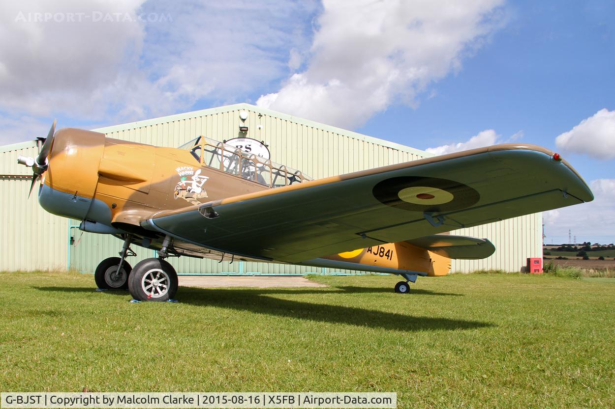 G-BJST, 1953 Canadian Car & Foundry T-6H Harvard Mk.4M C/N 14A-2429, Canadian Car & Foundry T-6H Harvard Mk4M in new camouflage finish by RS Paintworks at Fishburn Airfield, August 16th 2015.