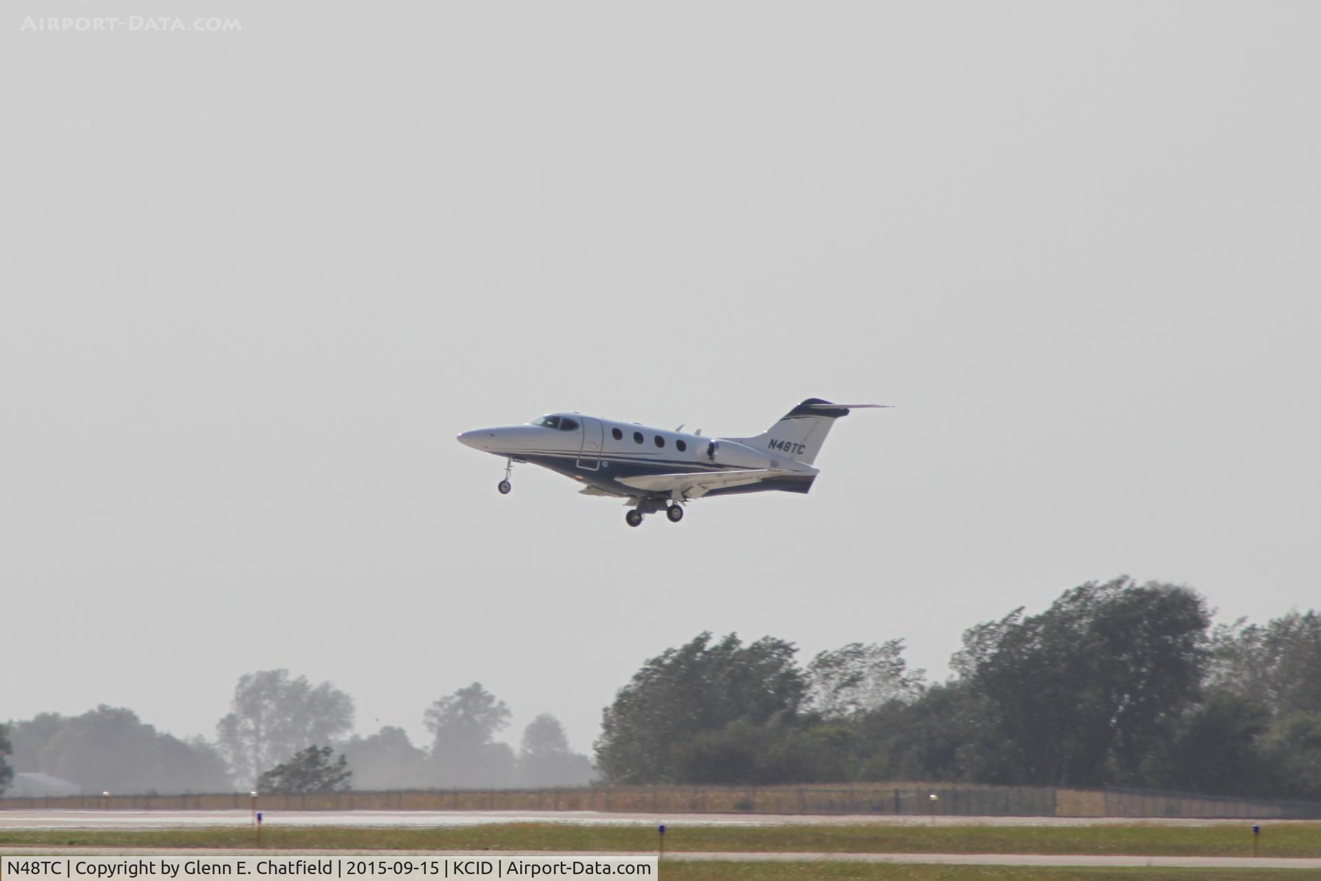 N48TC, Raytheon Aircraft Company 390 C/N RB-13, Departing runway 13, looking into the sun