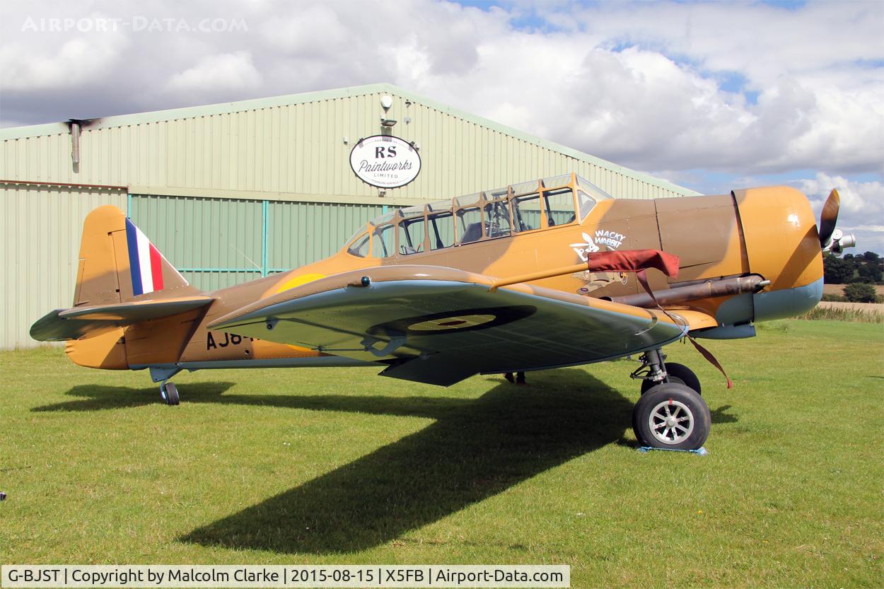 G-BJST, 1953 Canadian Car & Foundry T-6H Harvard Mk.4M C/N 14A-2429, Canadian Car & Foundry T-6H Harvard Mk4M in new camouflage finish by RS Paintworks at Fishburn Airfield, August 16th 2015.