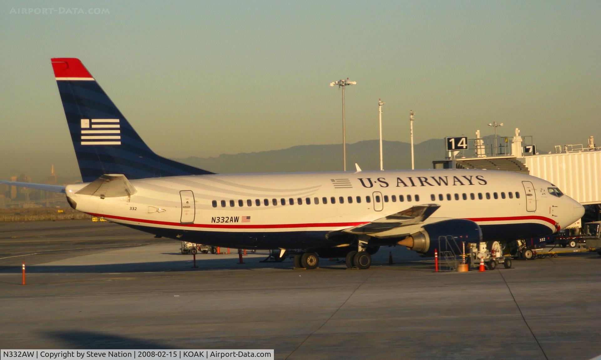 N332AW, 1987 Boeing 737-3B7 C/N 23384, US Airways 1987 Boeing 737-3B7 loading passengers @ Oakland International airport, CA (photographed from Southwest Airlines early morning KOAK-KBUR flight)