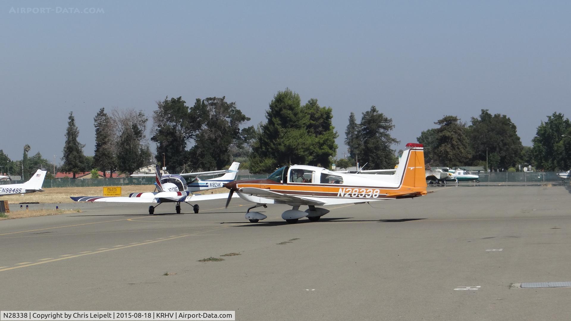 N28338, 1977 Grumman American AA-5B Tiger C/N AA5B0569, Locally-based 1977 Grumman American AA-5B Tiger taxing out for departure at Reid Hillview Airport, San Jose, CA. Note the very busy run-up area!