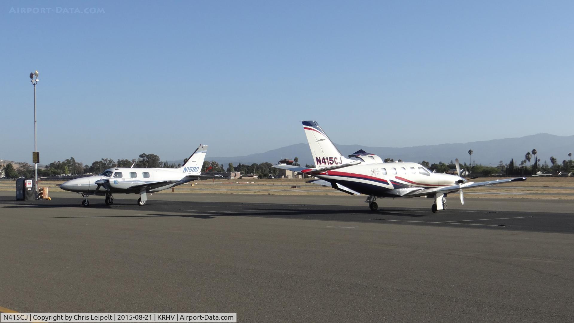 N415CJ, 2007 Socata TBM-700 C/N 415, Stratos Aviation LLC (Los Gatos, CA) 2007 Socata TBM-850 sitting next to a transient Piper Navajo at Reid Hillview Airport, San Jose, CA. Such a beautiful sight to see two rare planes next to each other!
