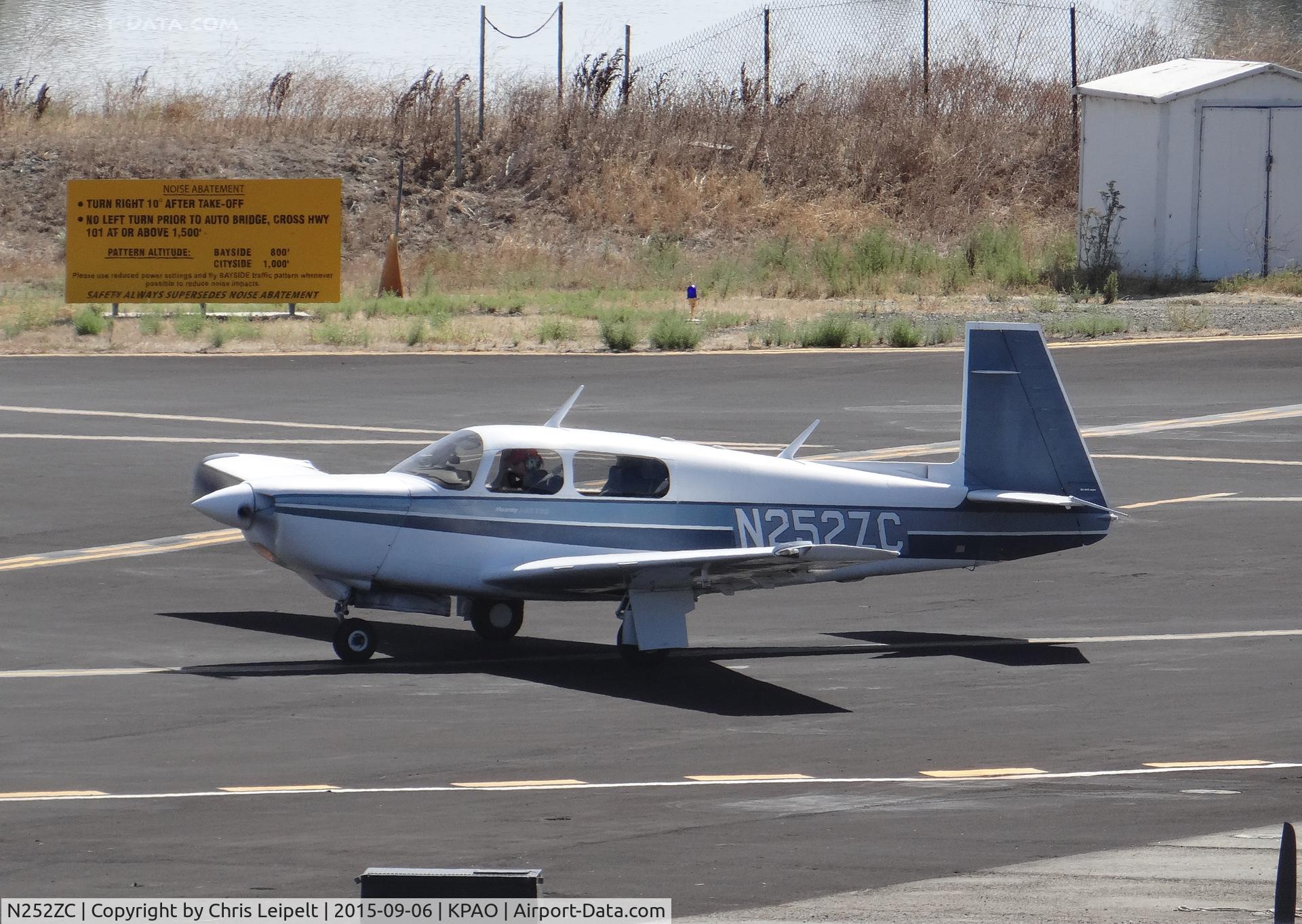 N252ZC, 1987 Mooney M20K C/N 25-1099, Locally-based 1987 Mooney M20K taxing out for departure at Palo Alto Airport, Palo Alto, CA. Photo taken from the control tower.