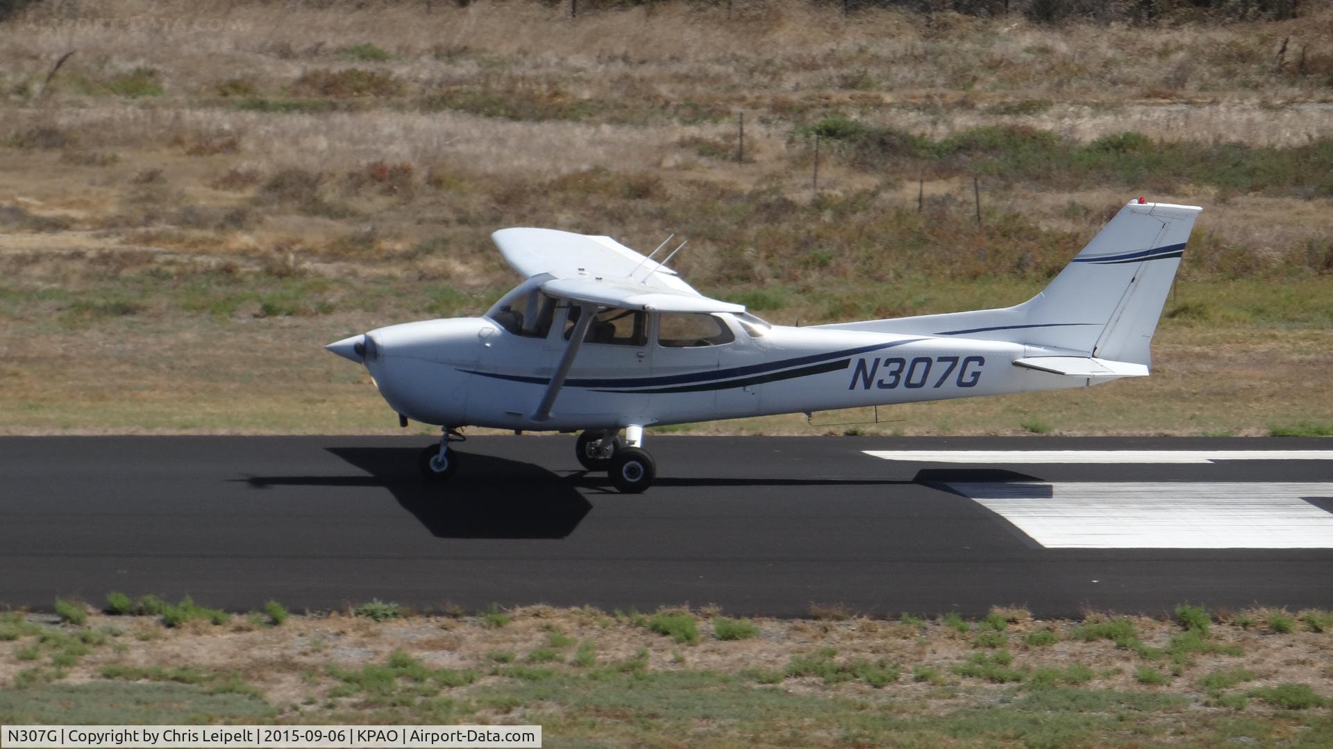N307G, 1974 Cessna 172M C/N 17263007, Gavilan Aviation (Hollister, CA) 1974 Cessna 172M rolling down runway 31 for departure at Palo Alto Airport, Palo Alto, CA. Photo taken from the control tower.
