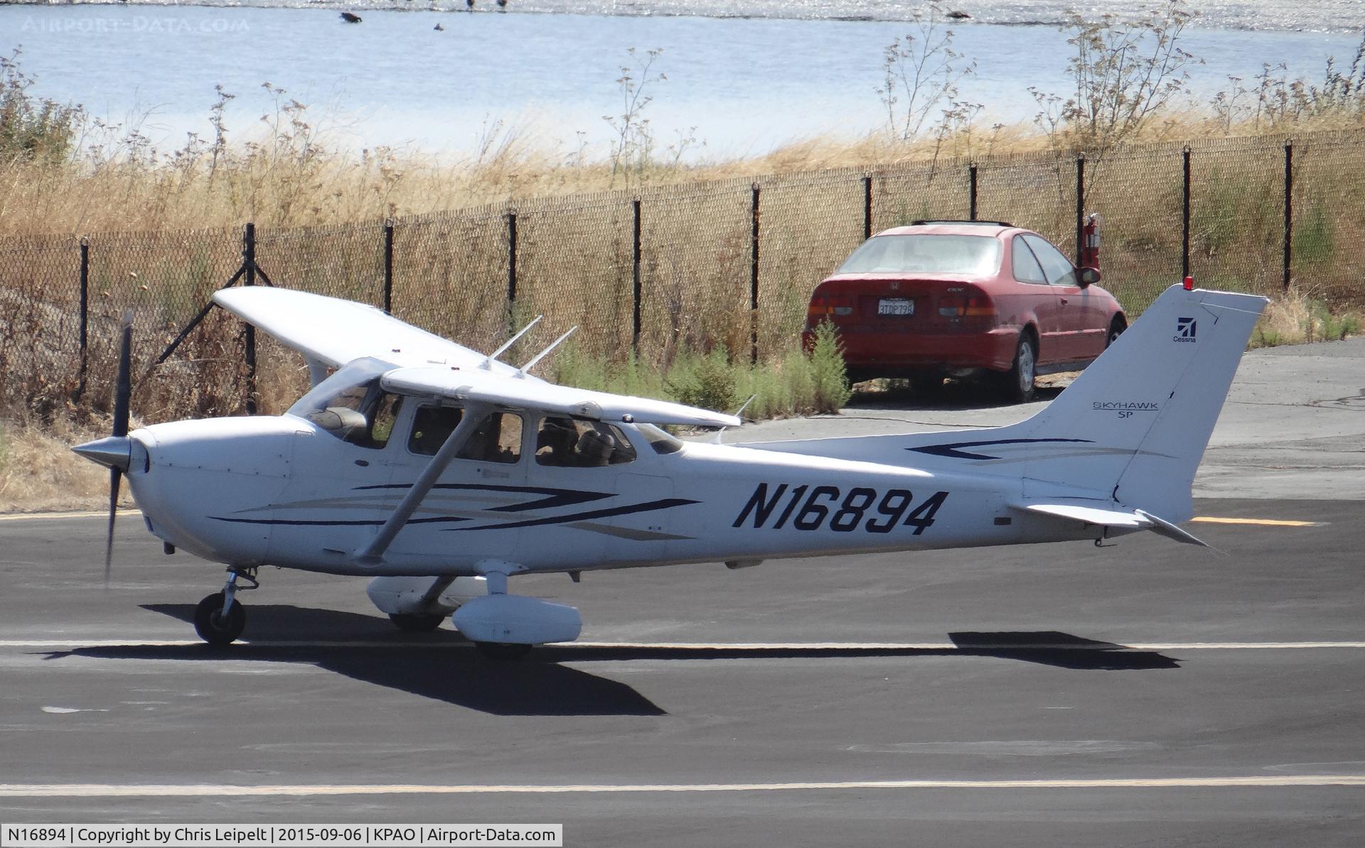 N16894, 2007 Cessna 172S C/N 172S10615, G Flux Aviation LLC (Sonoma, CA) 2007 Cessna 172S in the run up area preforming checklists at Palo Alto Airport, Palo Alto, CA. Photo taken from the control tower.