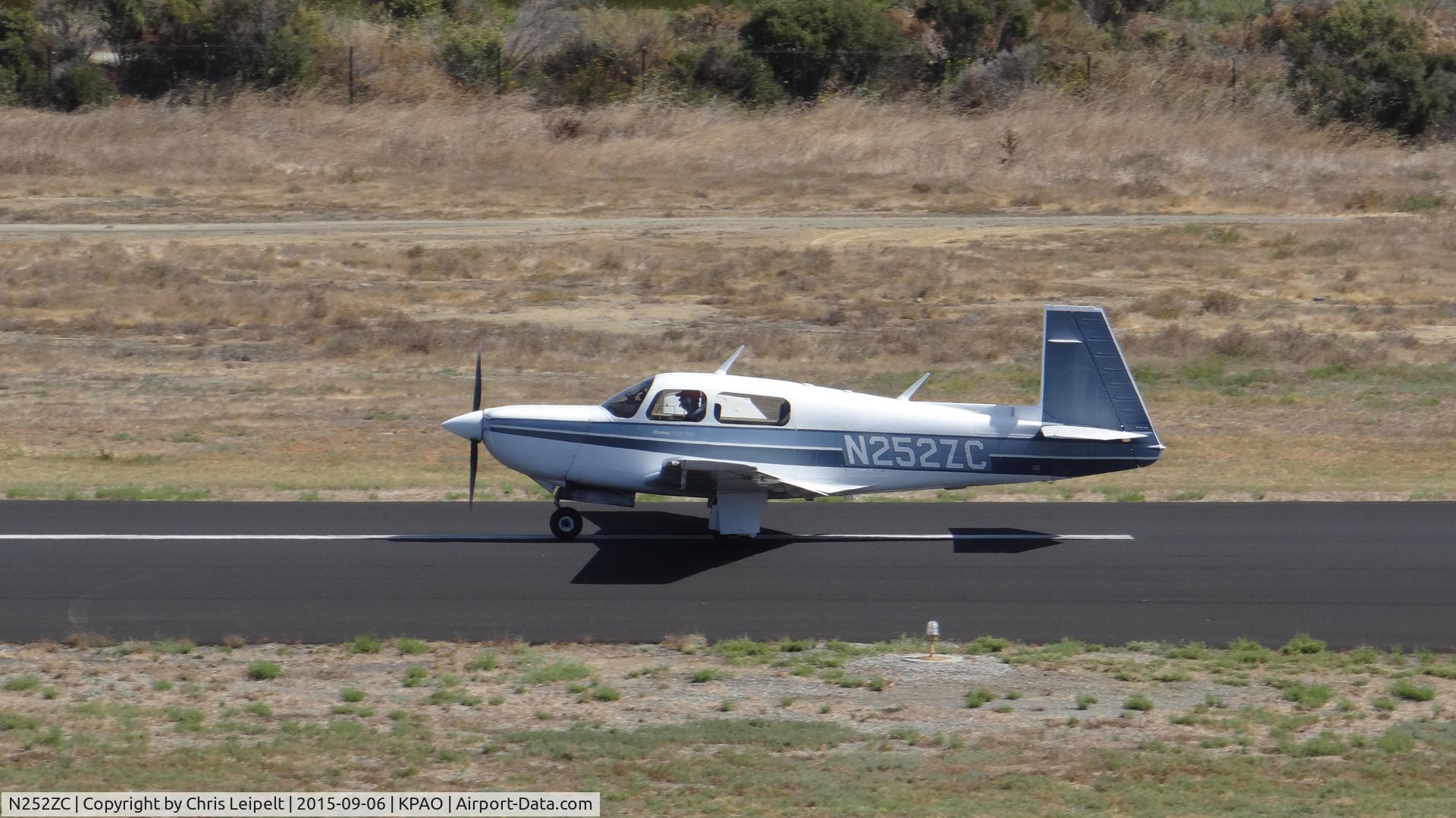 N252ZC, 1987 Mooney M20K C/N 25-1099, Locally-based 1987 Mooney M20K rolling down 31 for takeoff at Palo Alto Airport, Palo Alto, CA. Photo taken from the control tower.
