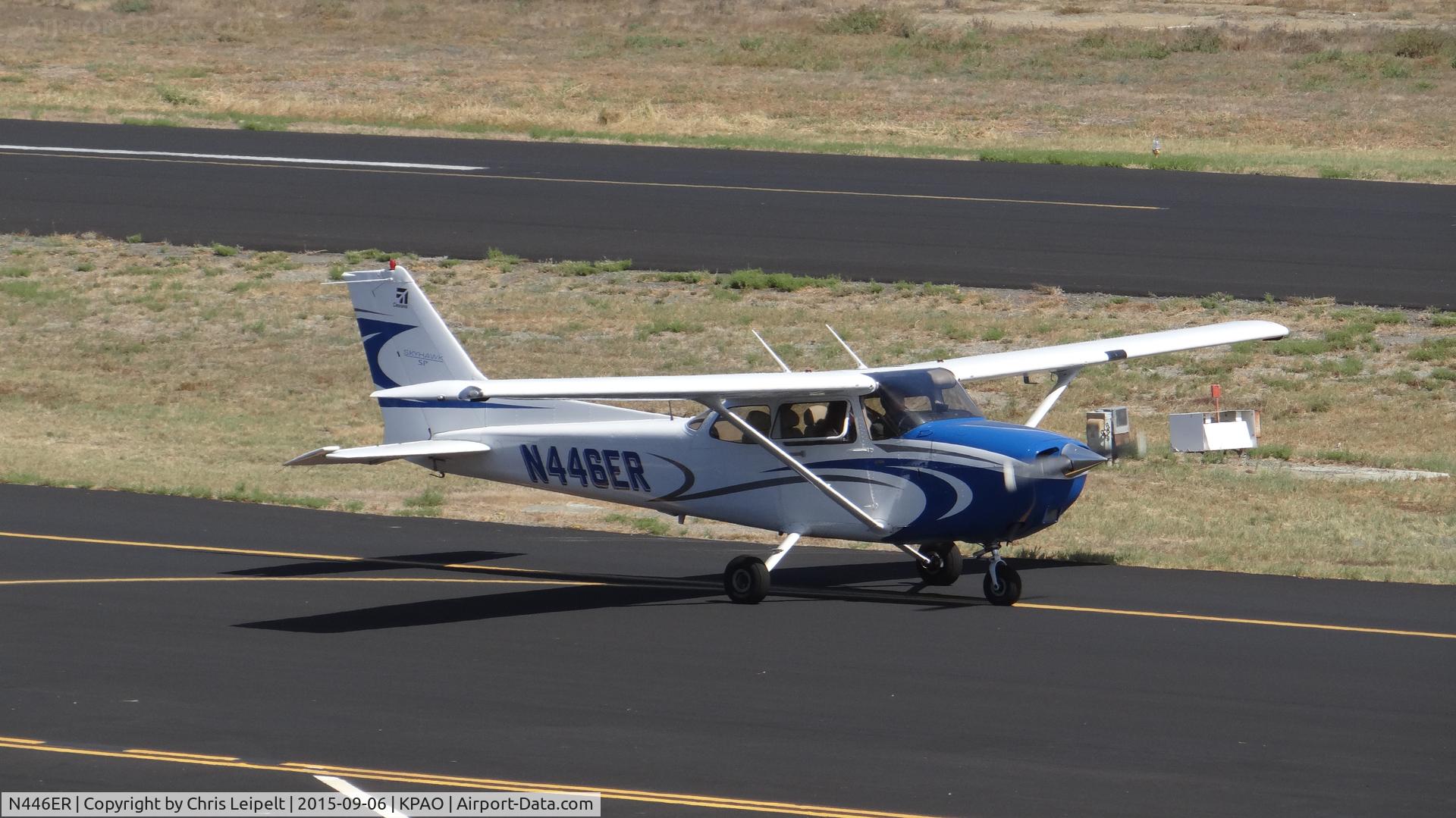 N446ER, 2006 Cessna 172S C/N 172S10220, Locally-based 2006 Cessna 172S taxing to its tie down after landing at Palo Alto Airport, Palo Alto, CA. Photo taken from the control tower.
