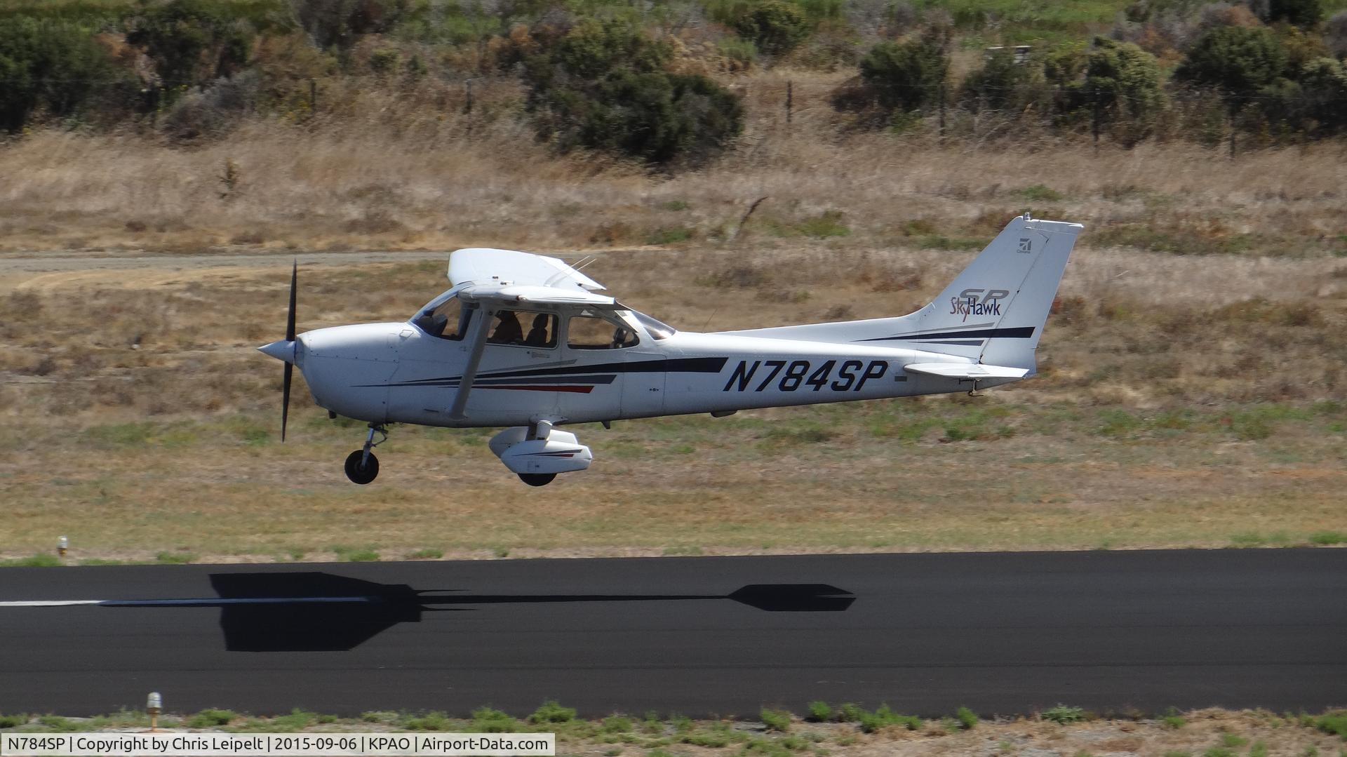 N784SP, 2001 Cessna 172S C/N 172S8711, Locally-based 2001 Cessna 172S departing (with flaps) on runway 31 at Palo Alto Airport, Palo Alto, CA. Photo taken from the control tower.