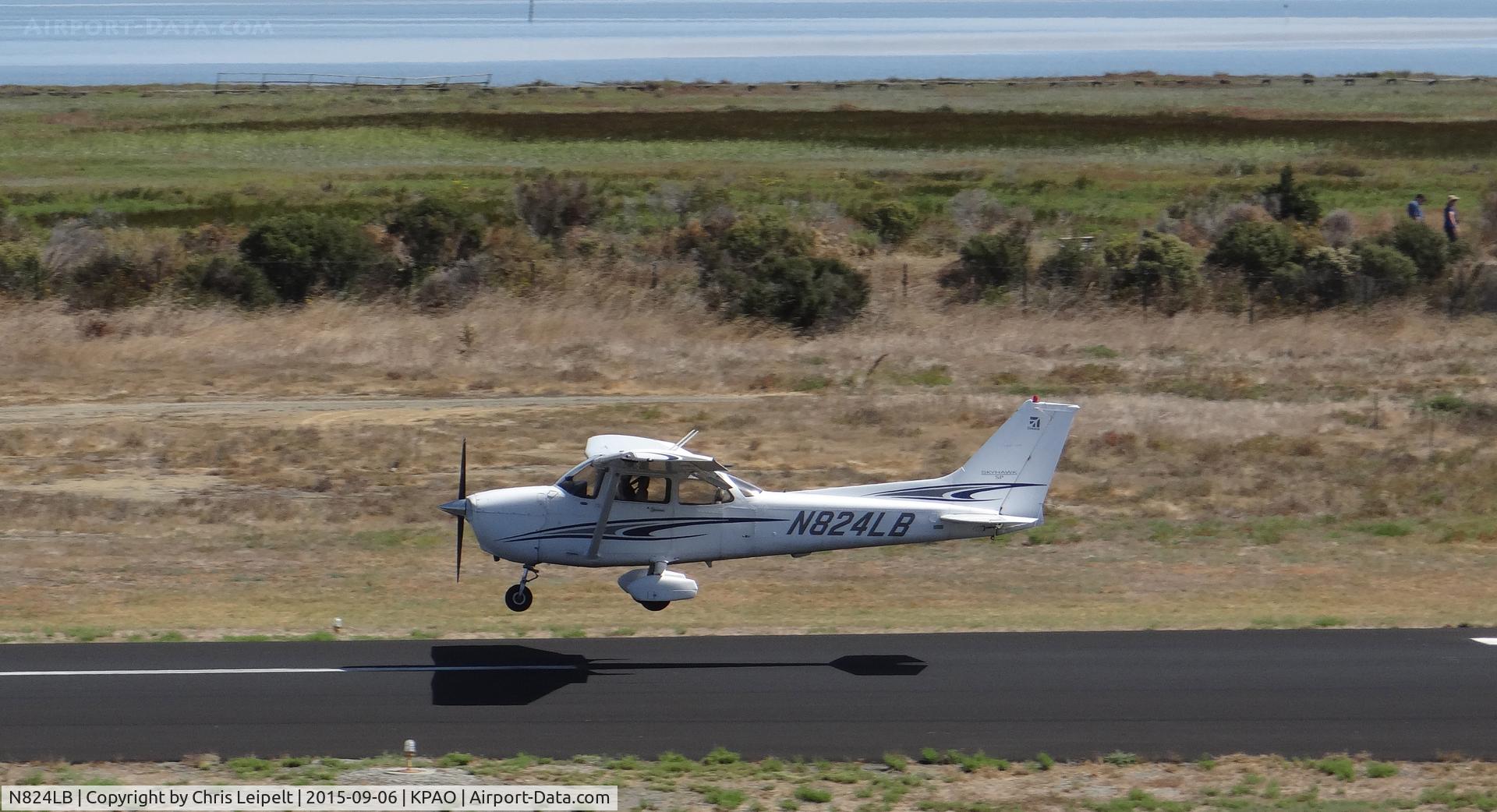N824LB, 2005 Cessna 172S C/N 172S9824, Reid Hillview-based 2005 Cessna 172S landing runway 31 at Palo Alto Airport, Palo Alto, CA. Photo taken from the control tower. This photo gives a great view of the bay in the background.