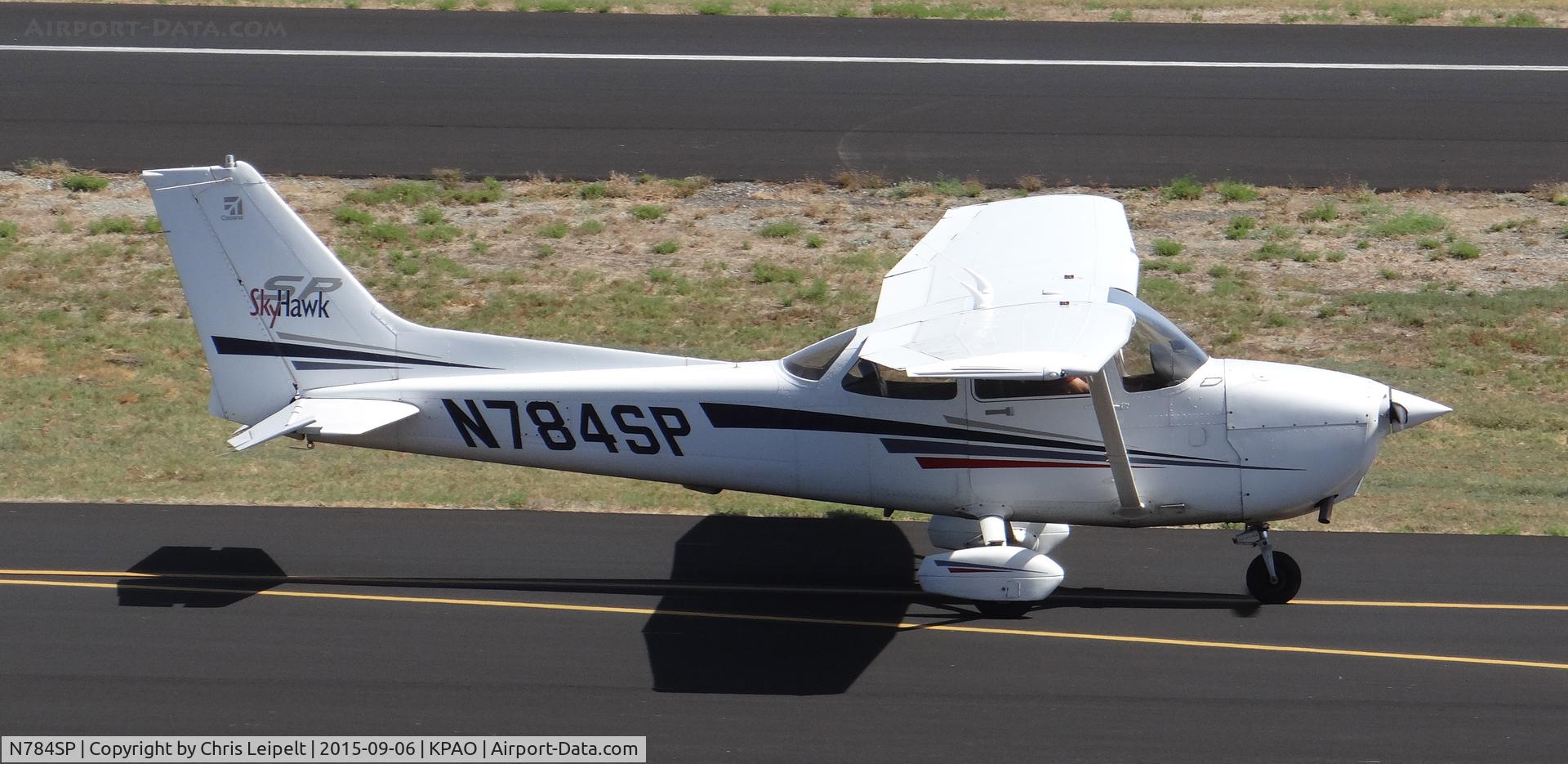 N784SP, 2001 Cessna 172S C/N 172S8711, Locally-based 2001 Cessna 172S taxing back to runway 31 for departure at Palo Alto Airport, Palo Alto, CA. Photo taken from the control tower.