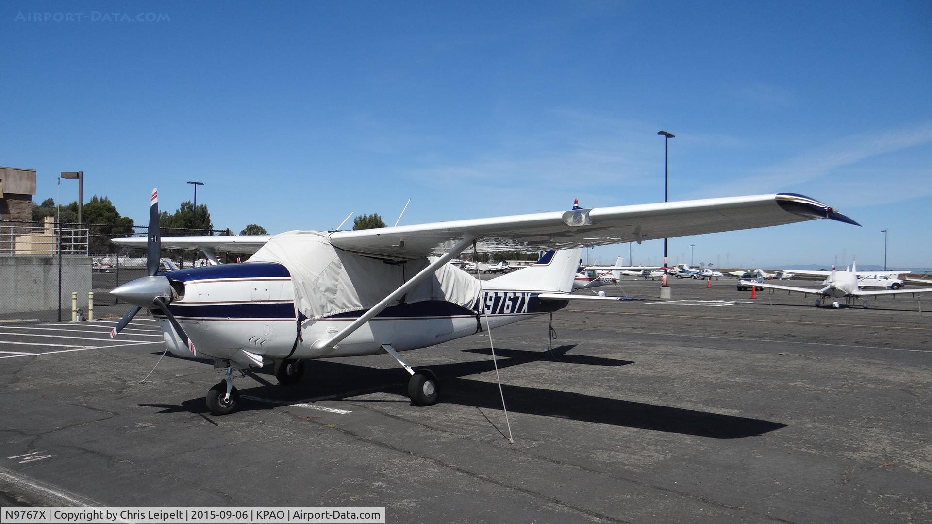N9767X, 1962 Cessna 210B C/N 21058067, Locally-based 1962 Cessna 210B sitting at its tie down at Palo Alto Airport, Palo Alto, CA.