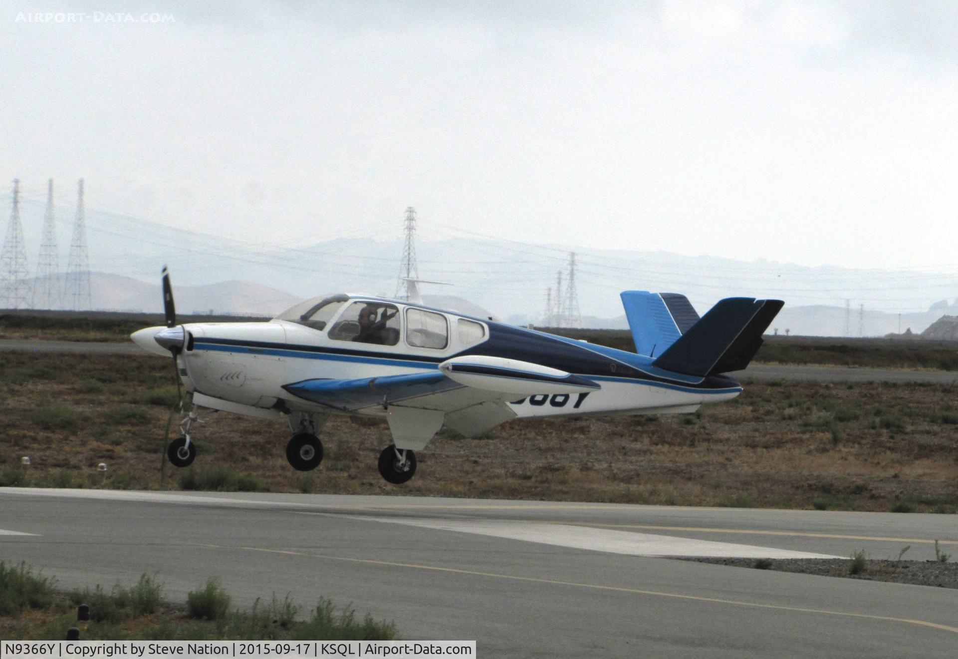 N9366Y, 1960 Beech M35 Bonanza C/N D-6509, 1960 Beech M35 over threshold on overcast morning @ San Carlos Municipal Airport, CA