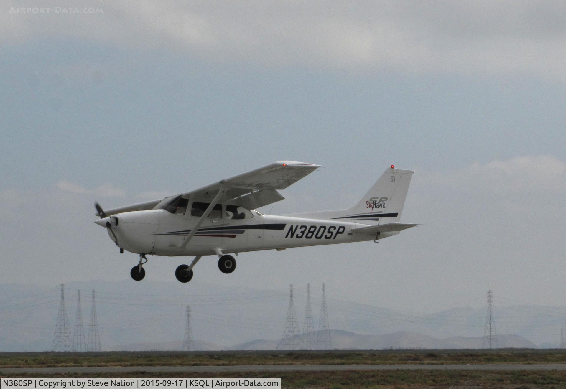 N380SP, 2001 Cessna 172S C/N 172S8774, Locally-Based 2001 Cessna 172S over threshold on an overcast morning @ San Carlos Municipal Airport, CA