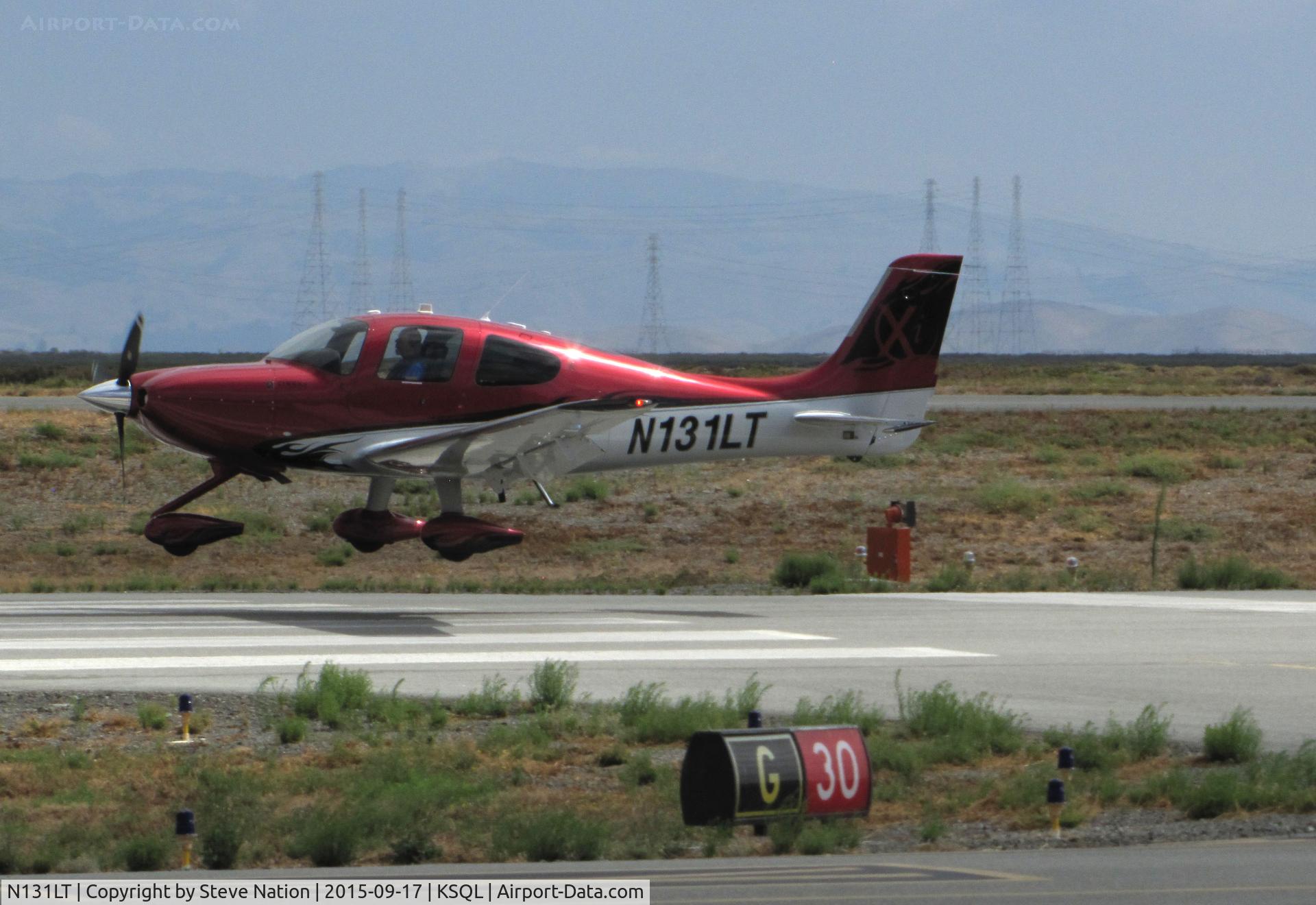 N131LT, 2012 Cirrus SR22T C/N 0300, 2012 Cirrus Design SR22T over the threshold @ San Carlos Municipal Airport, CA