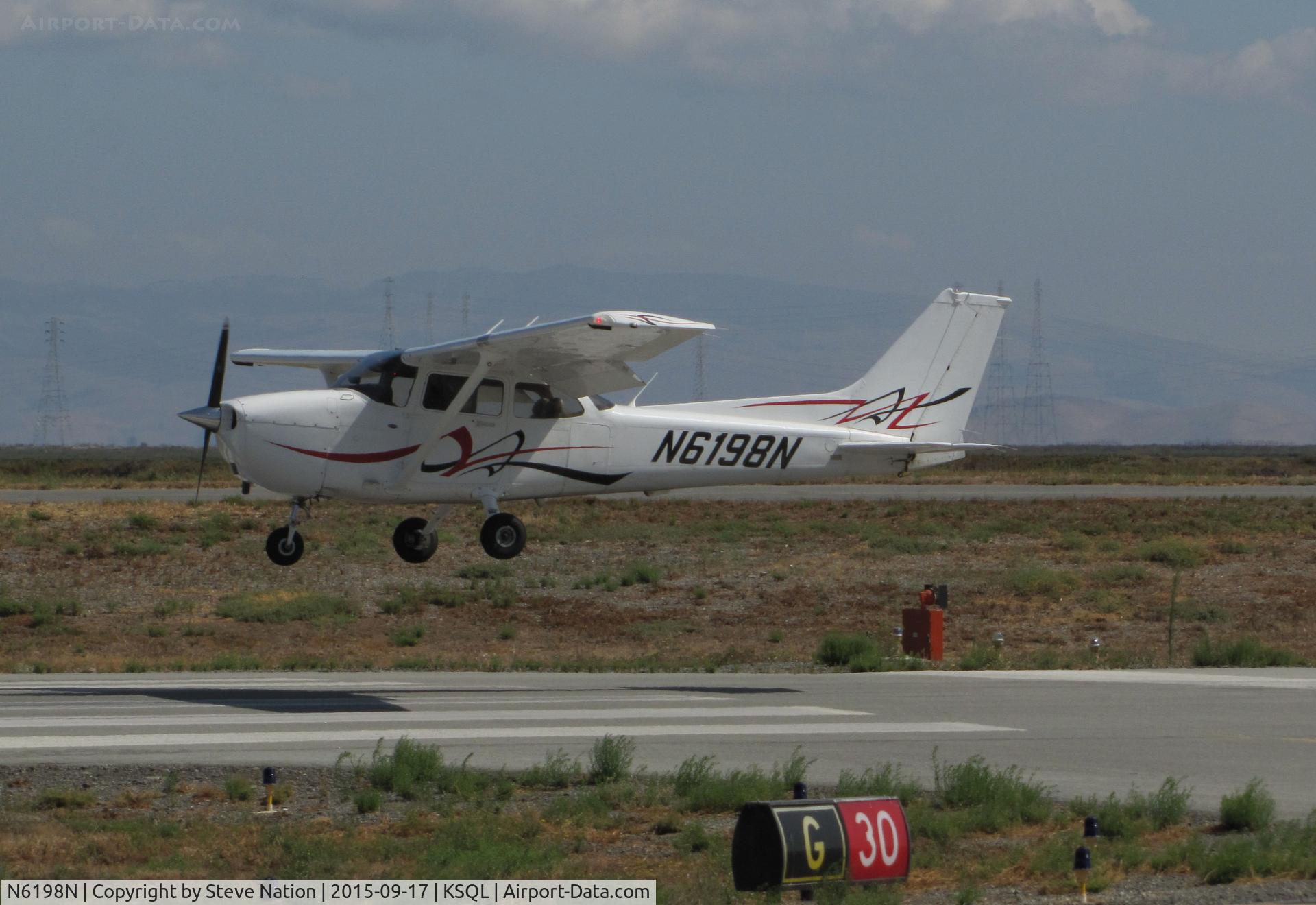 N6198N, 2008 Cessna 172S C/N 172S10792, Locally-Based 2008 Cessna 172S over the threshold @ San Carlos Municipal Airport, CA
