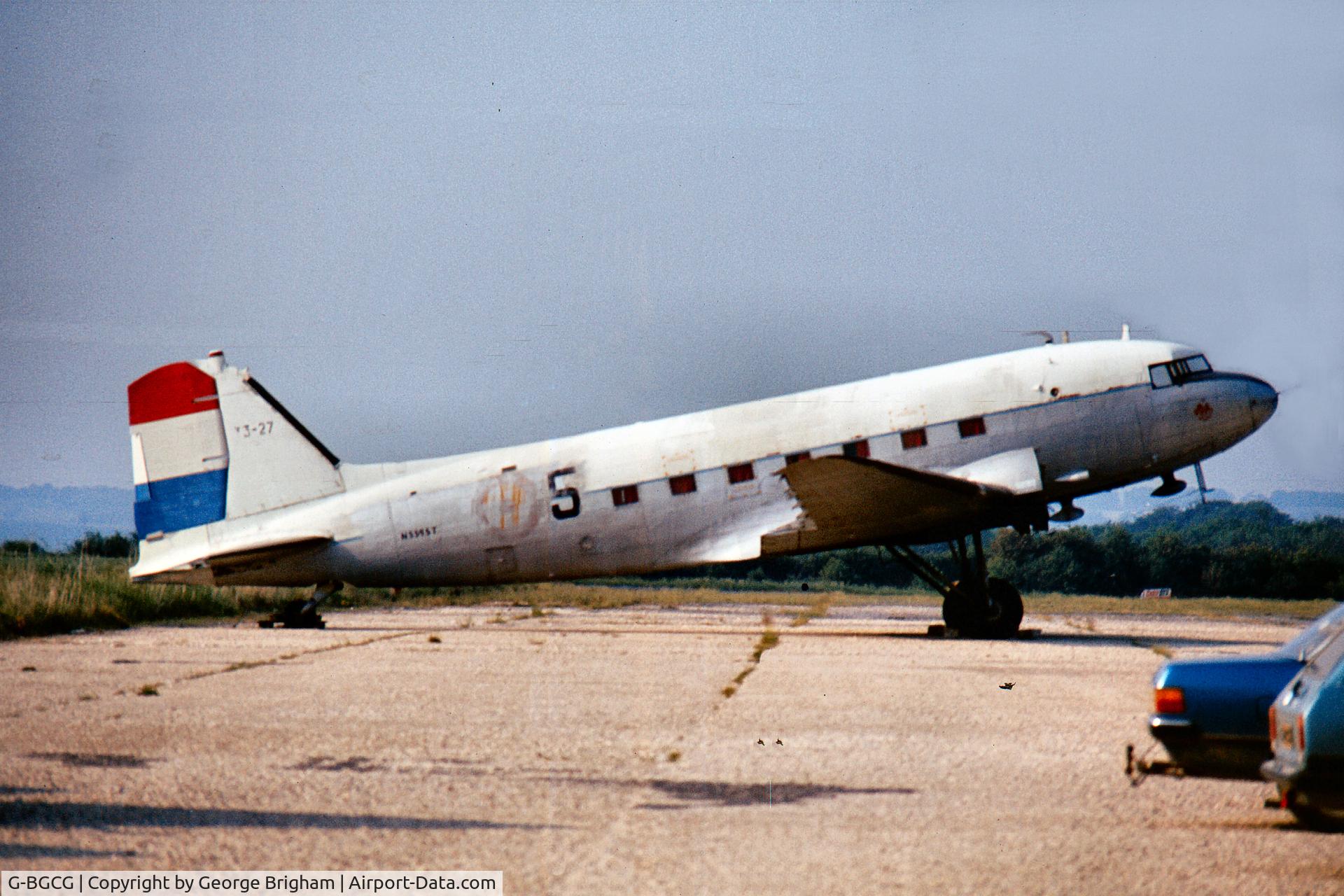 G-BGCG, 1944 Douglas C-47A Skytrain C/N 20002, This was taken at Thruxton many years ago. From the colour, the rudder appears to be from a KLM example. It was marked both T3-27 & N5595T at this time.