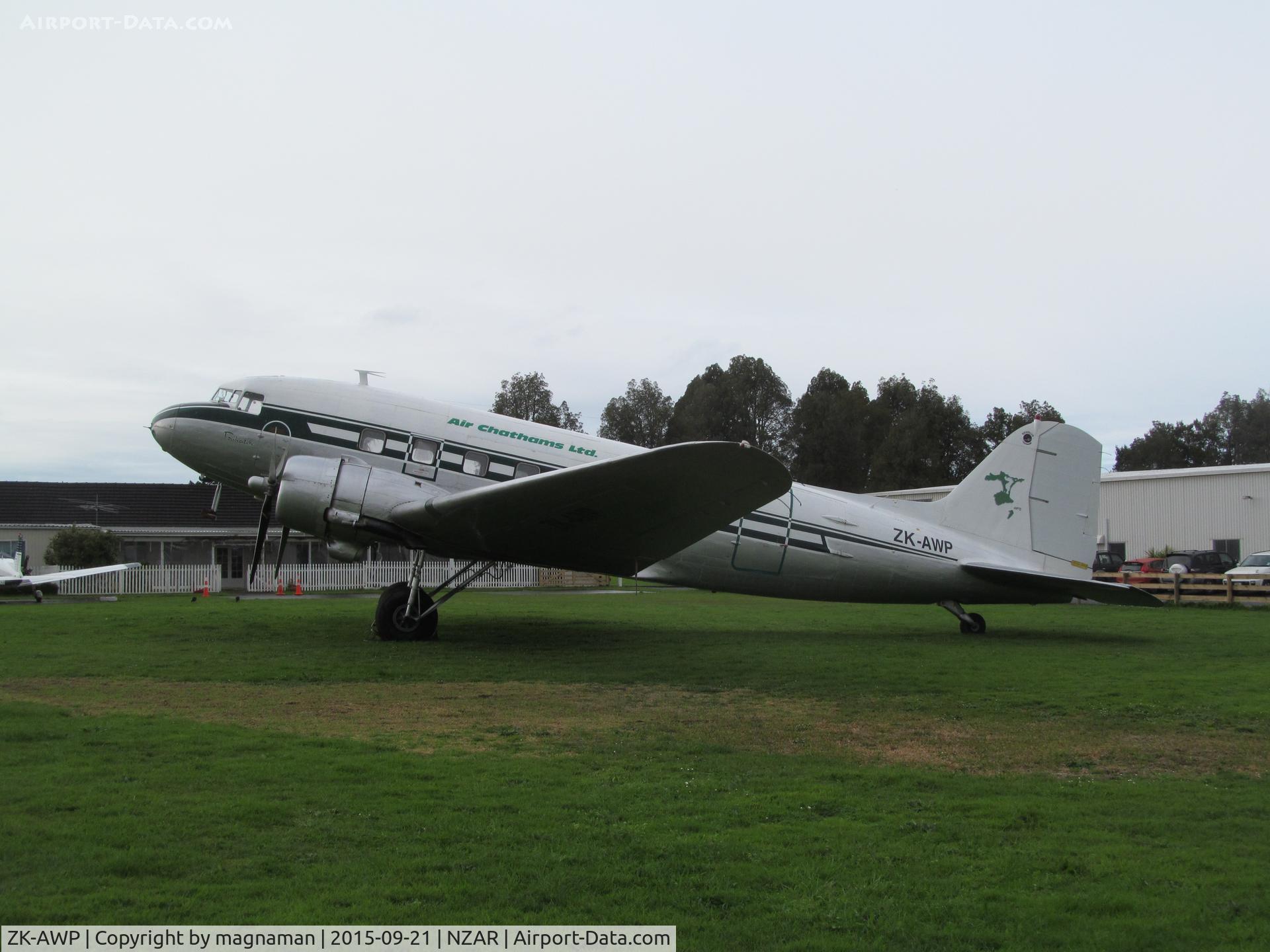 ZK-AWP, 1945 Douglas DC-3 (C-47B-30-DK) C/N 33135, on a damp grass parking area at Ardmore