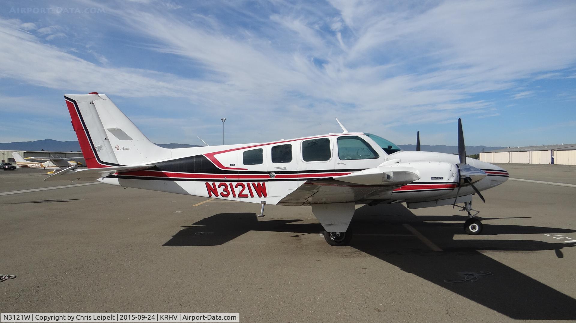 N3121W, 1973 Beech 58 Baron C/N TH-410, Santa Barbara-based 1973 Beechcraft Baron 58 sitting at the south tie downs at Reid Hillview Airport, San Jose, CA.