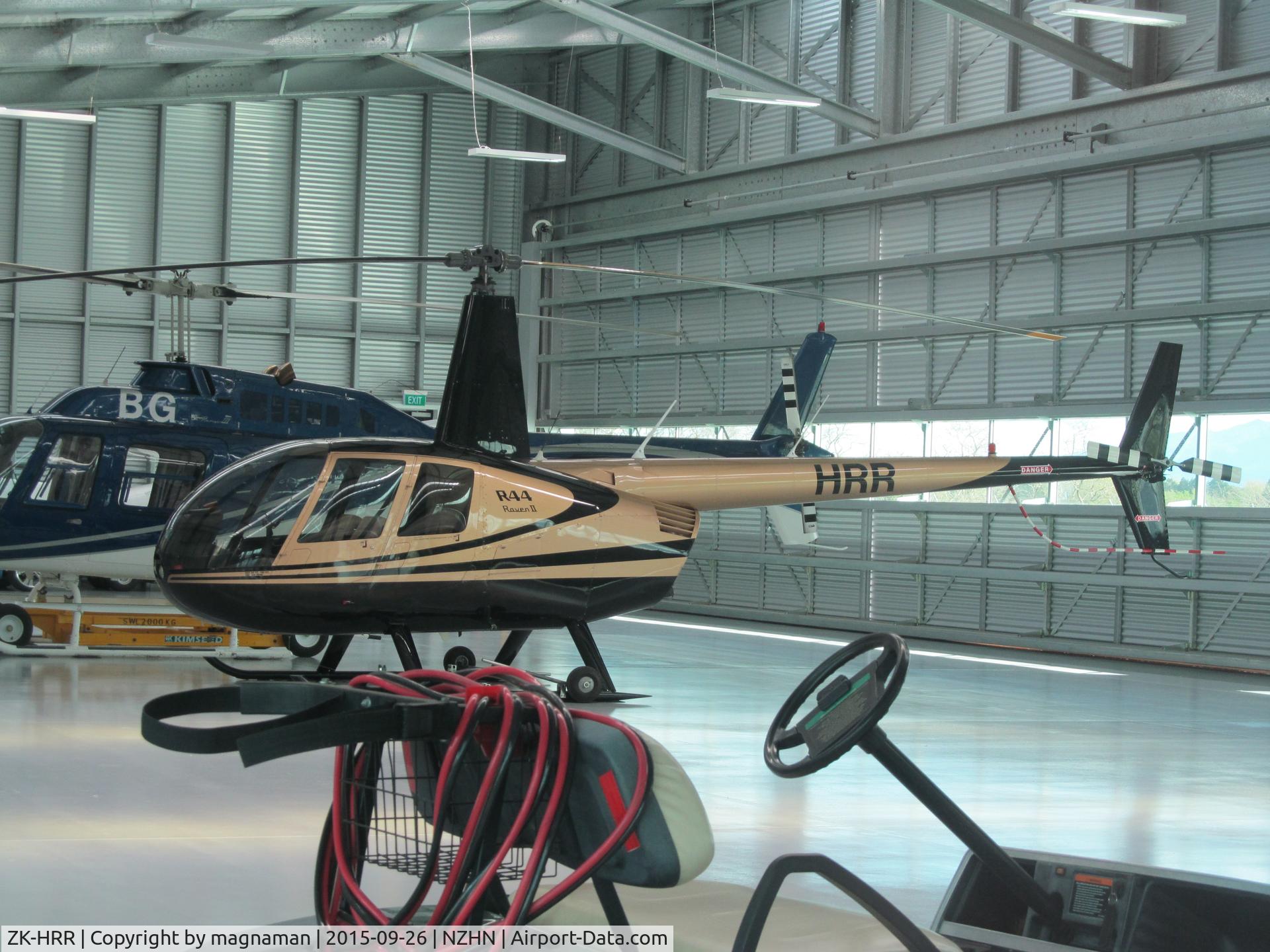 ZK-HRR, Robinson R44 II C/N 10084, inside heliport hangar