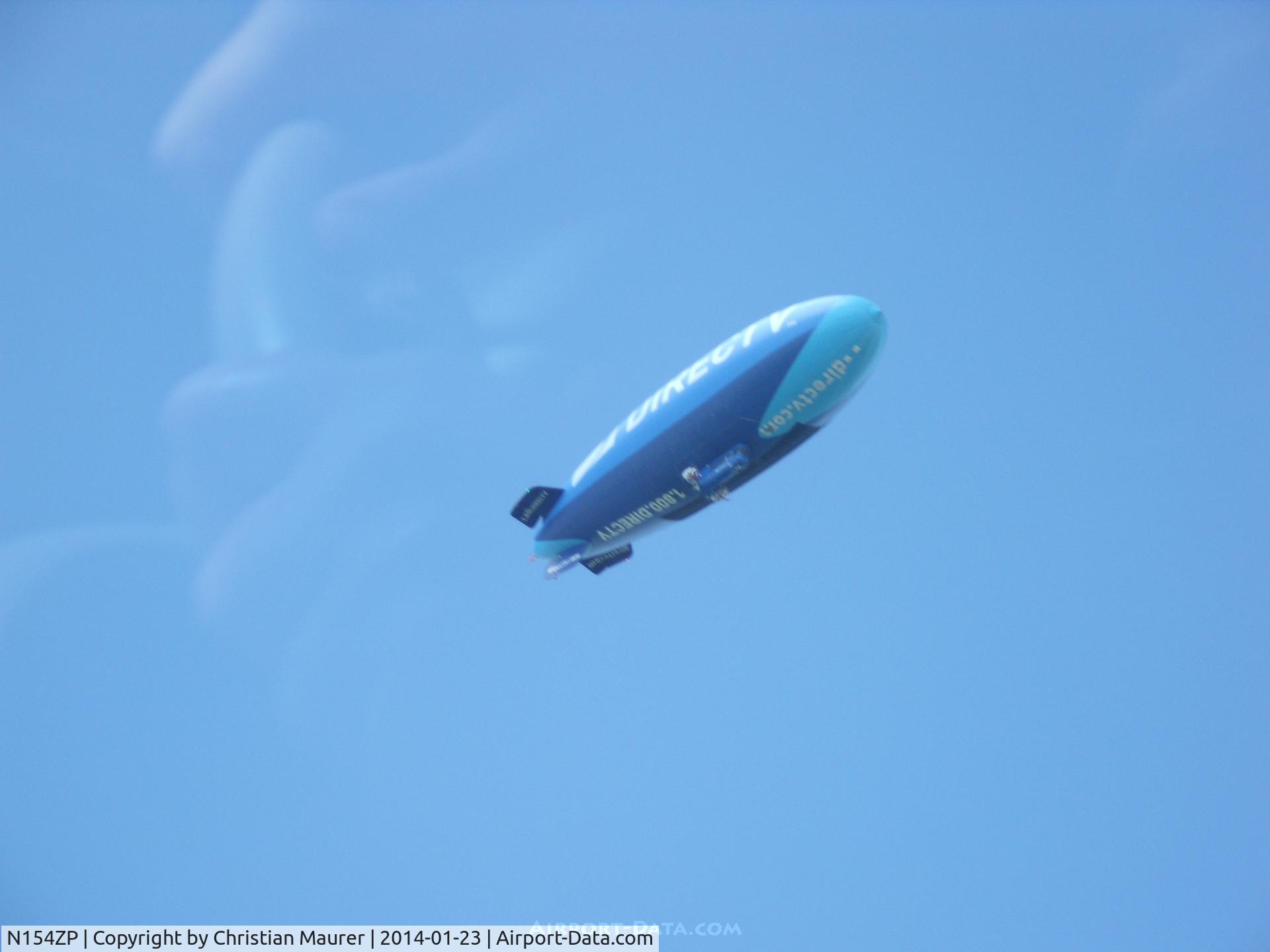 N154ZP, 1999 American Blimp Corp A-1-70 C/N 104, Direct TV Blimp flying over my School