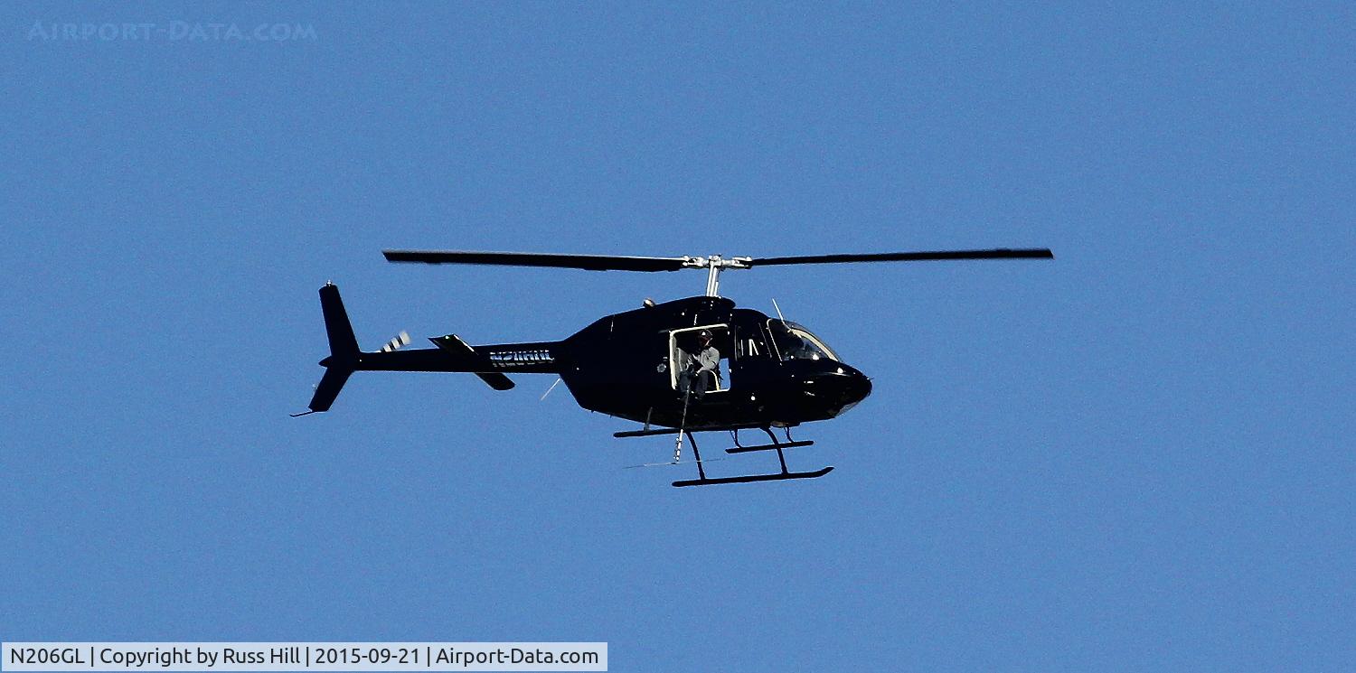 N206GL, Bell 206B JetRanger III C/N 2929, Hovering over Oak Park, MI.