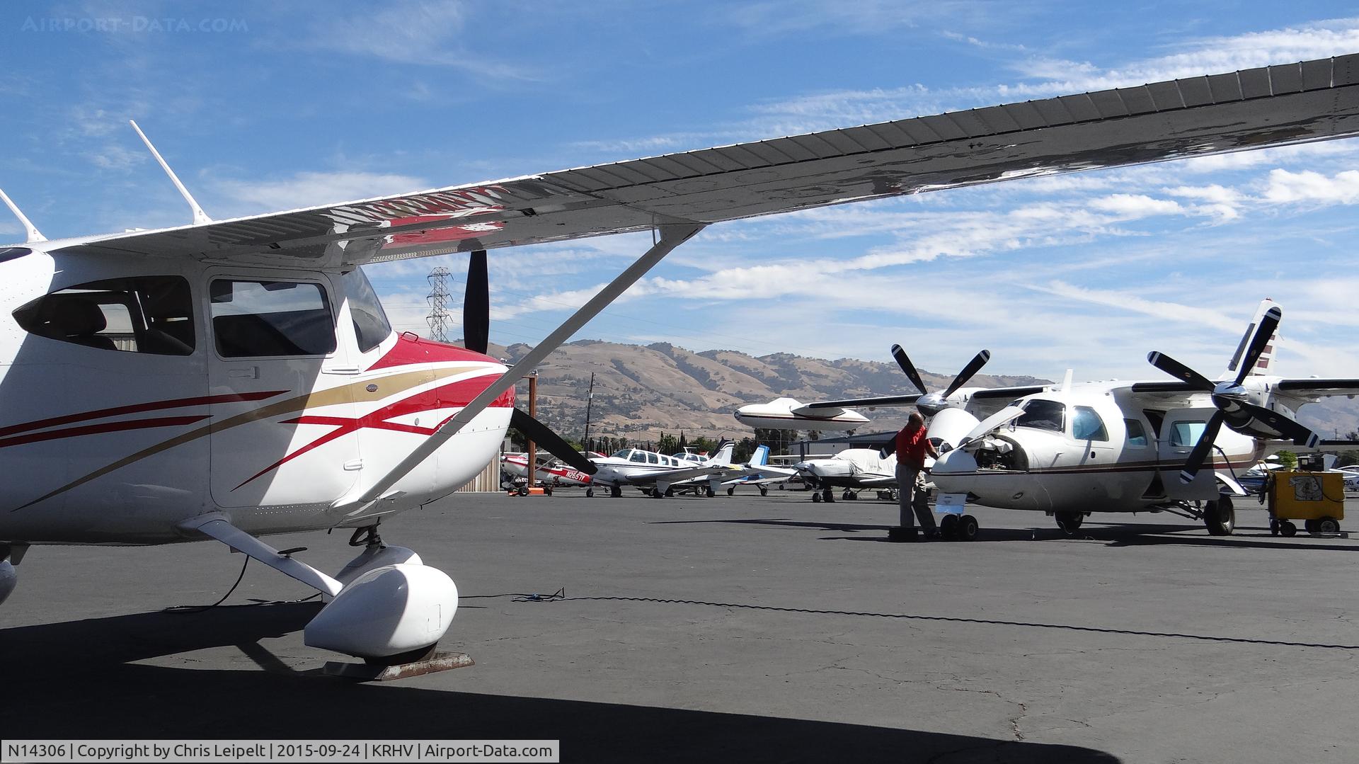 N14306, 2007 Cessna T182T Turbo Skylane C/N T18208681, Palo Alto-based 2007 Cessna T182T getting avionics maintenance done along with a Mitsubishi MU-2 at Reid Hillview Airport, San Jose, CA.