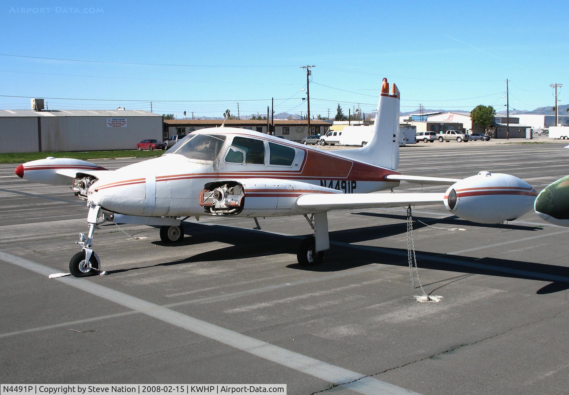 N4491P, 1958 Cessna 310B C/N 35771, This Cessna 310 with no props and damaged left engine @ Whiteman Airport, Pacoima, CA in Feb 2008 does not have a valid registration according to FAA. Can anyone help ID this aircraft?