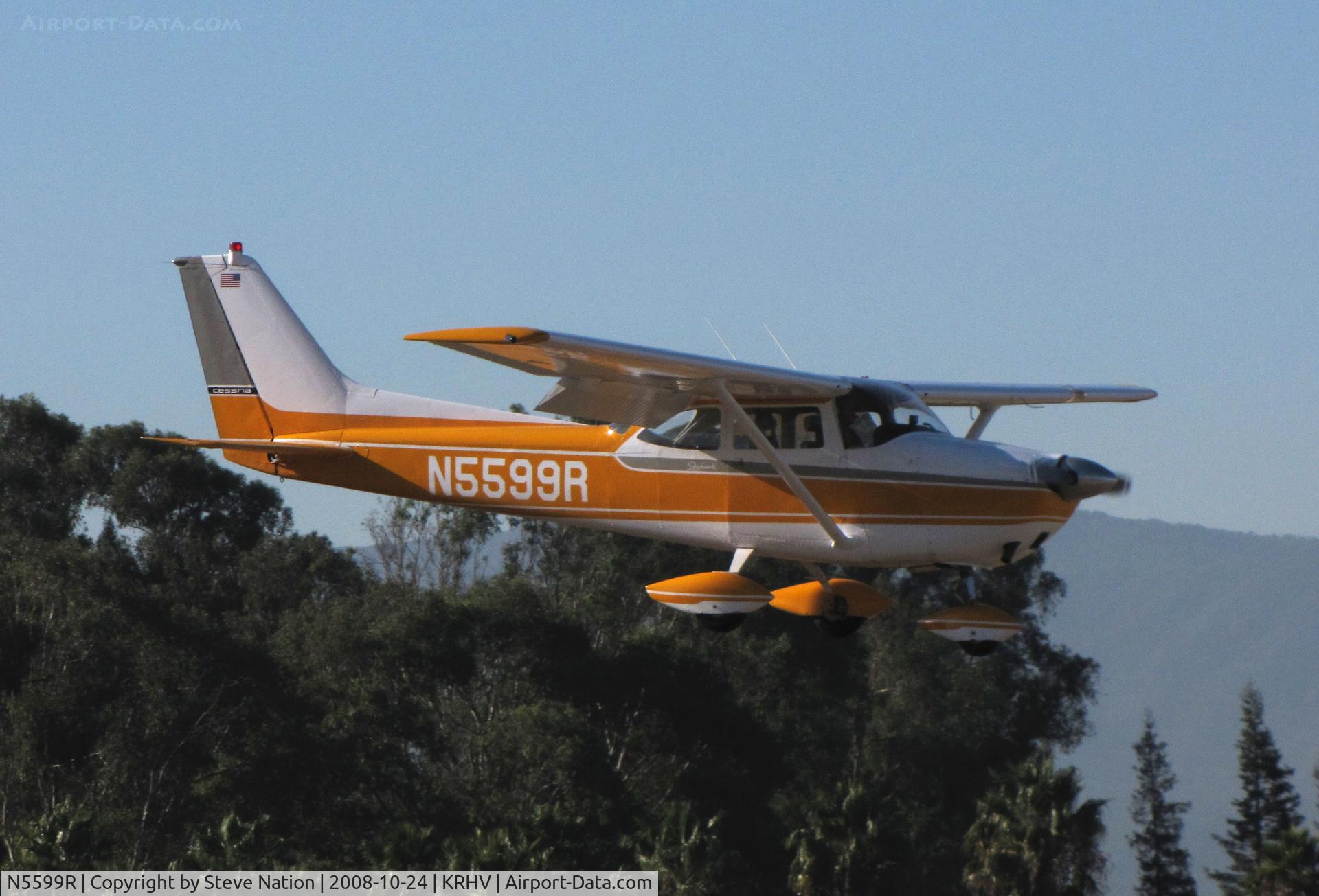 N5599R, 1965 Cessna 172F C/N 17253205, Colorful, locally-based 1965 Cessna 172F over the threshold @ Reid-Hillview Airport, San Jose, CA