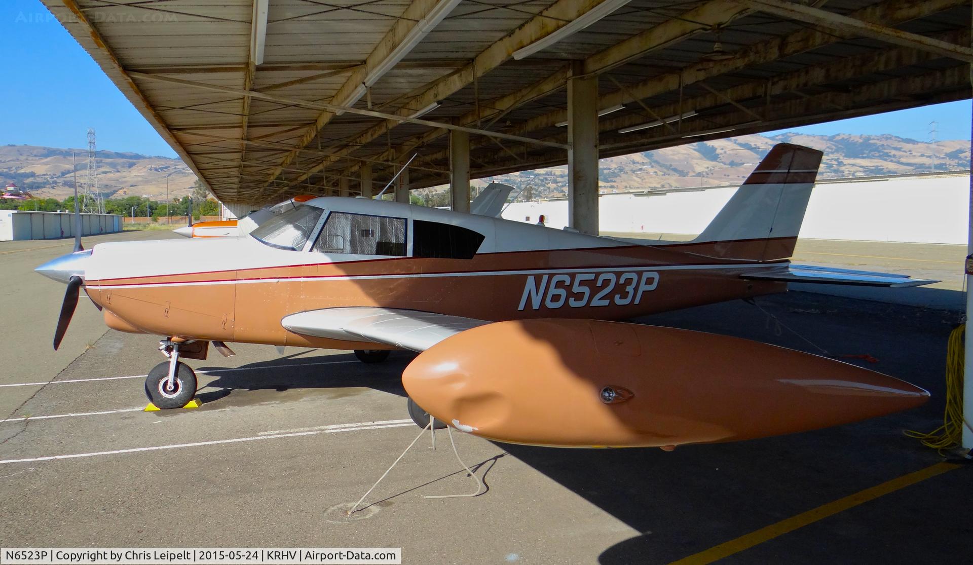 N6523P, 1959 Piper PA-24-250 Comanche C/N 24-1645, Locally-based 1959 Piper Comanche (with tip-tanks) sitting at its tie down under the shelters at Reid Hillview Airport, San Jose, CA.