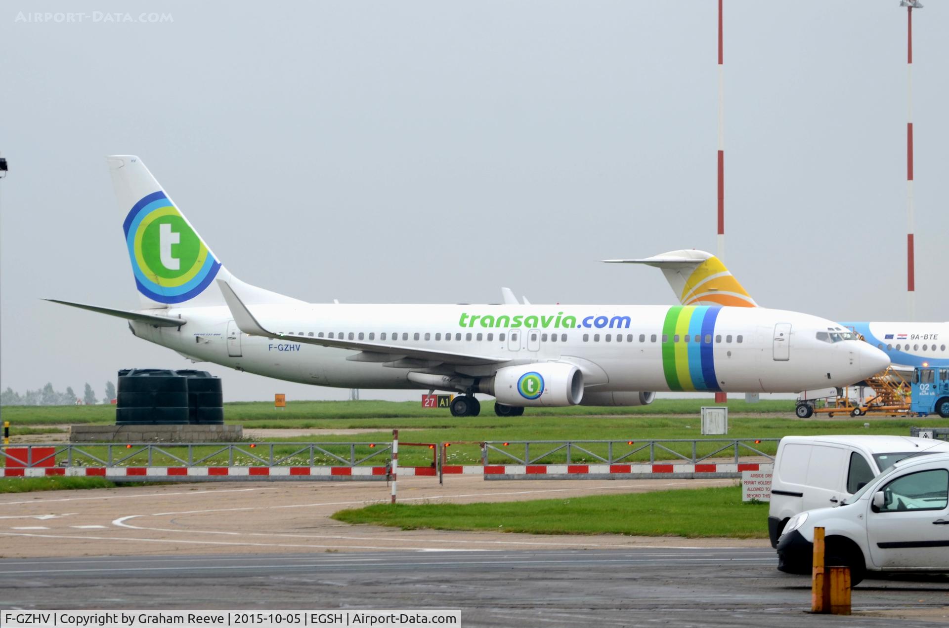 F-GZHV, 1998 Boeing 737-85H C/N 29444, Parked at Norwich on a wet afternoon.