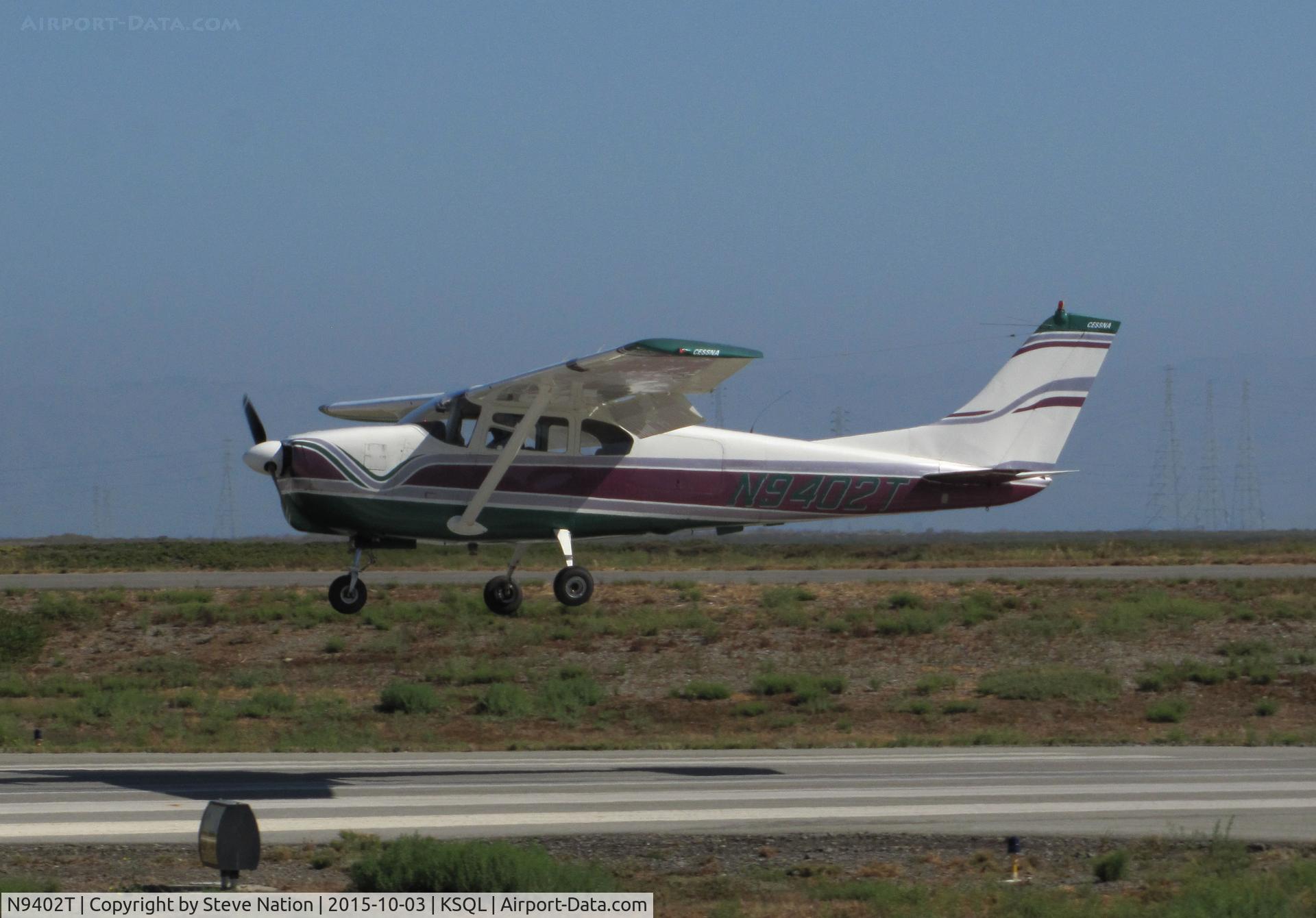 N9402T, 1960 Cessna 210 C/N 57202, 1960 Cessna 210 arriving from North Dakora over the threshold @ San Carlos Airport, CA