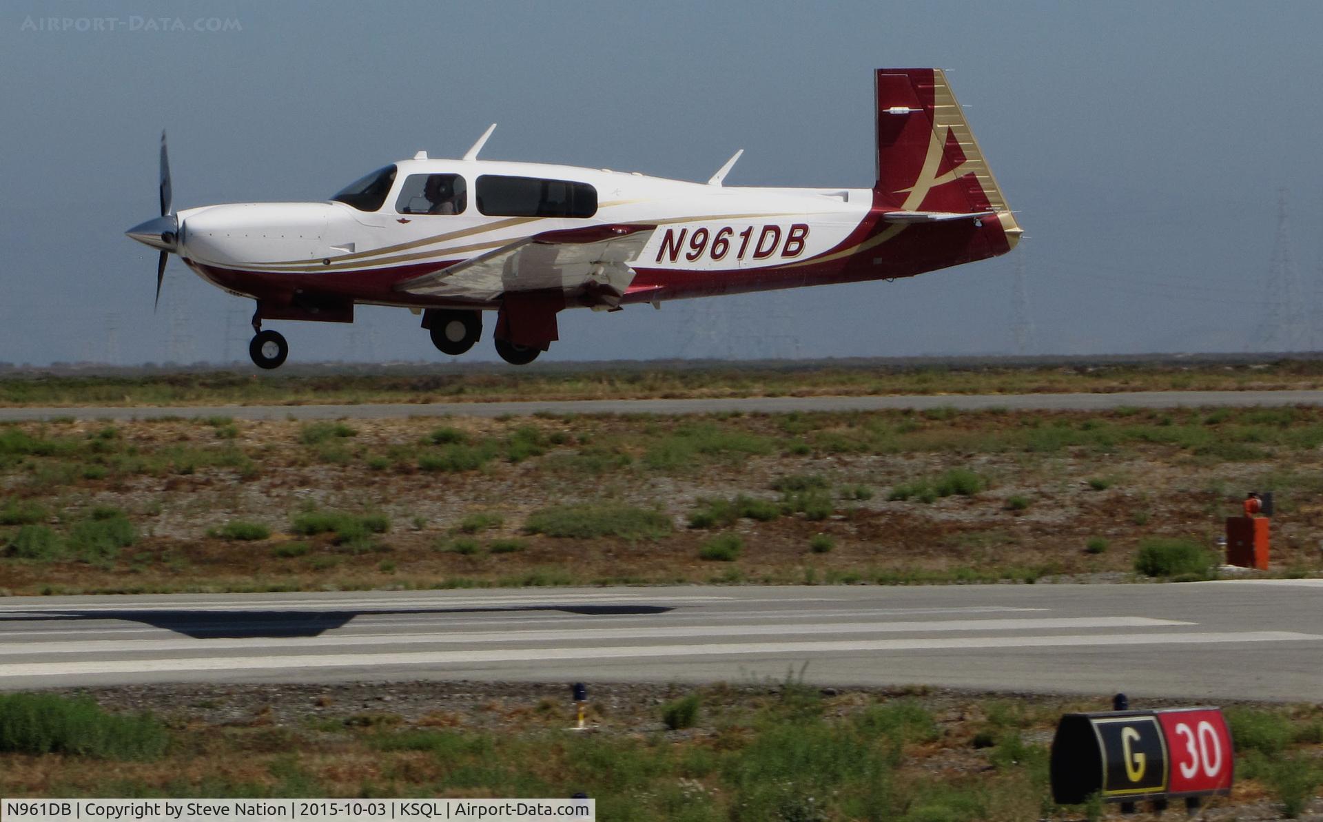 N961DB, 2007 Mooney M20TN Acclaim C/N 31-0048, 2007 Mooney M20TN from Lake Tahoe, CA over the threshold @ San Carlos Airport, CA