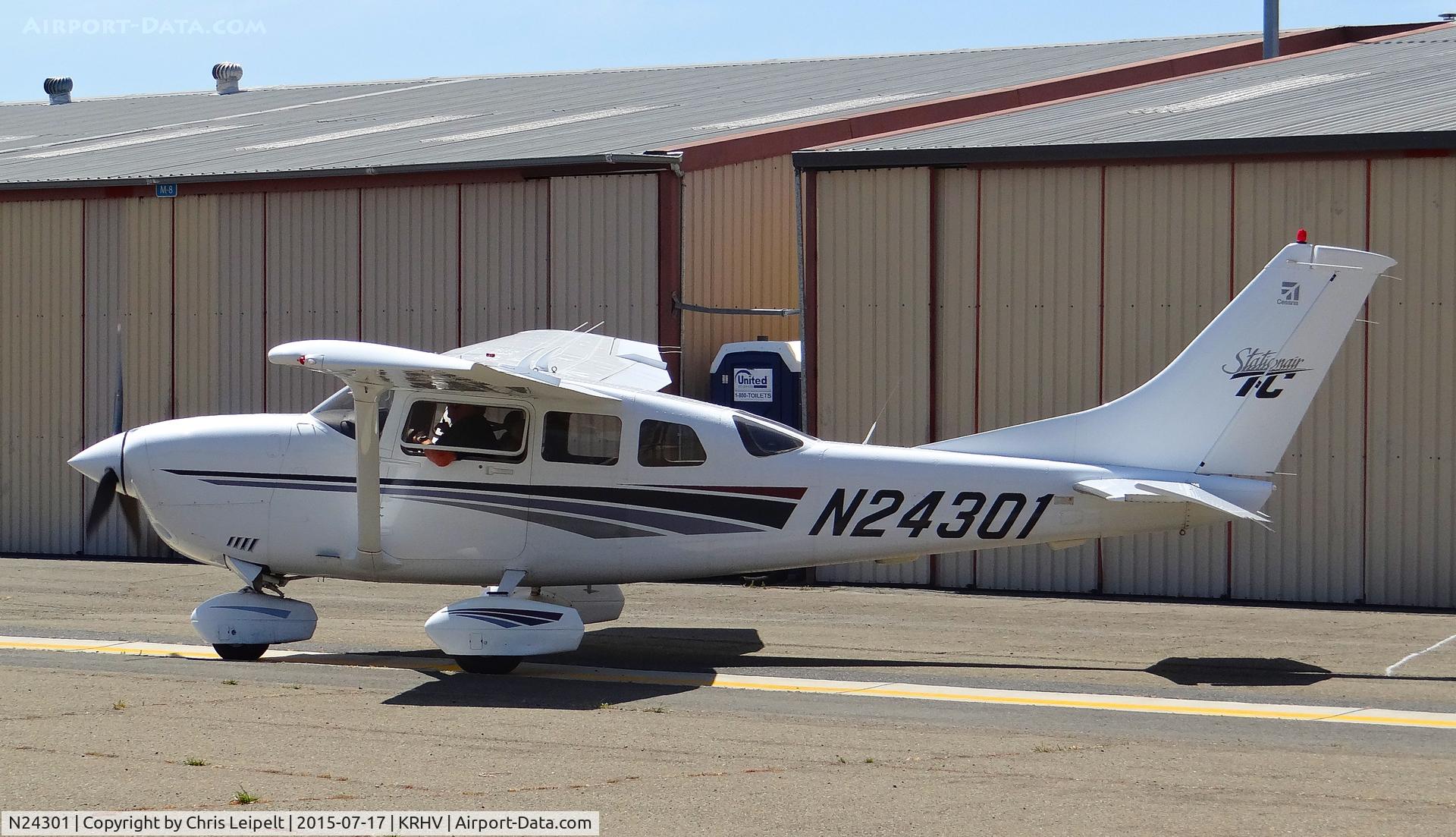 N24301, 1999 Cessna T206H Turbo Stationair C/N T20608139, Locally-based 1999 Cessna T206H taxing out from its hangar for departure at Reid Hillview Airport, San Jose, CA.