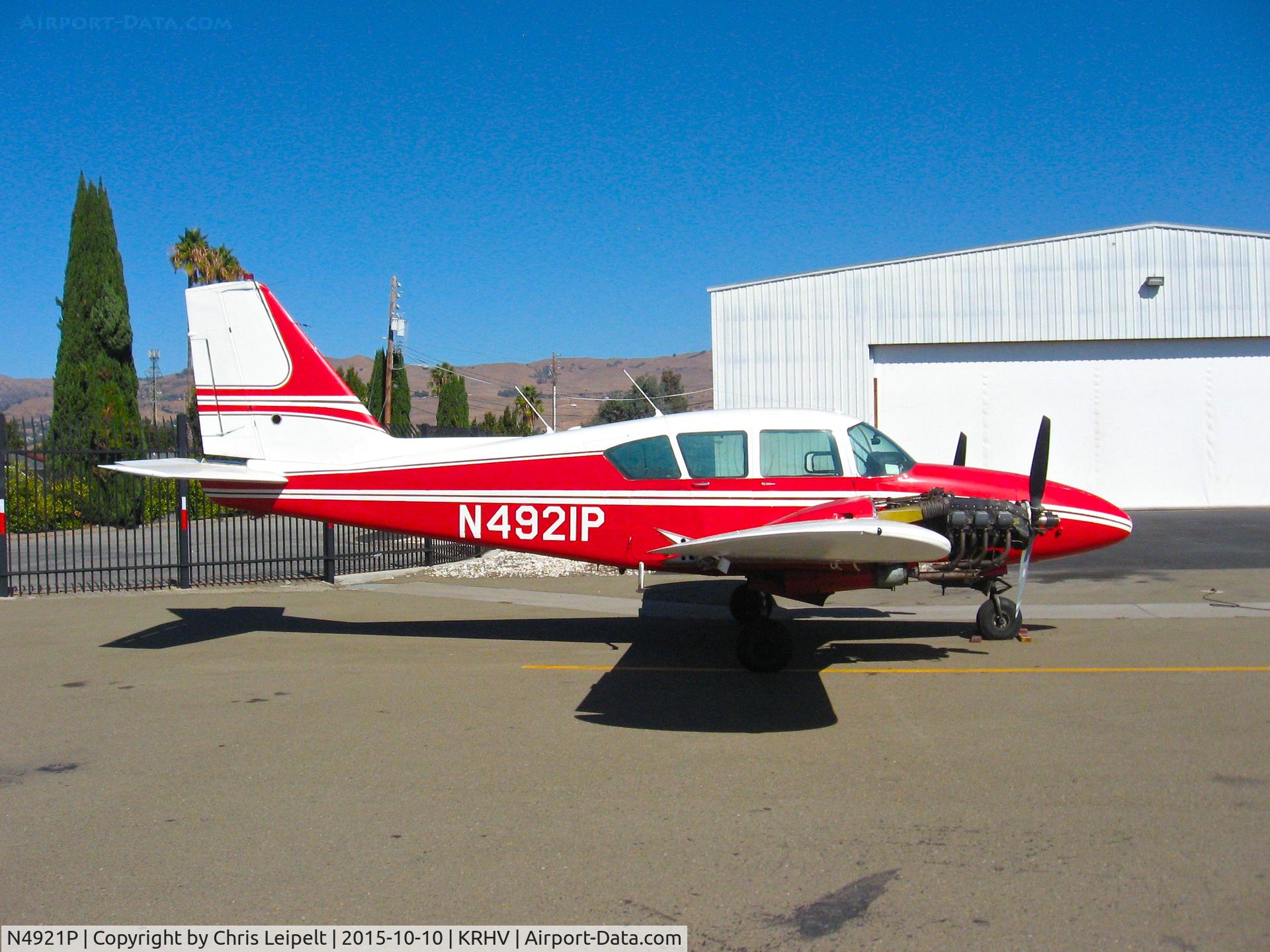 N4921P, 1962 Piper PA-23-235 Apache C/N 27-511, Locally-based 1962 Piper Aztec (with both engine cowlings removed) sitting on the Victory Aero ramp for major inspection at Reid Hillview Airport, San Jose, CA.