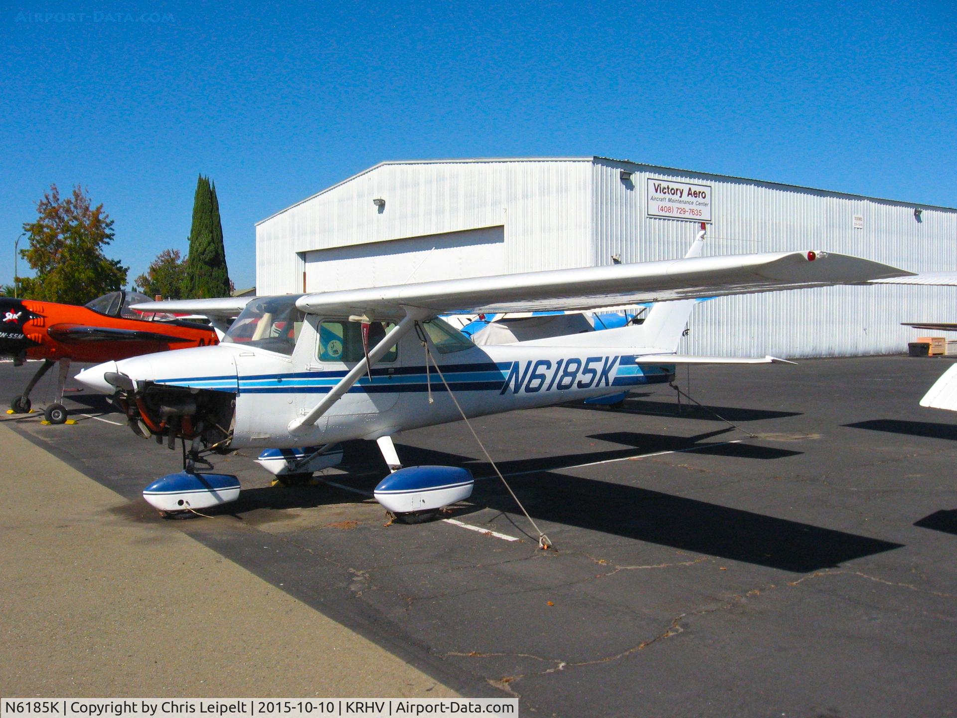 N6185K, 1975 Cessna 150M C/N 15077576, Locally-based 1975 Cessna 150M sitting on the Victory Aero ramp (with bottom engine cowling removed) for maintenance at Reid Hillview Airport, San Jose, CA.
