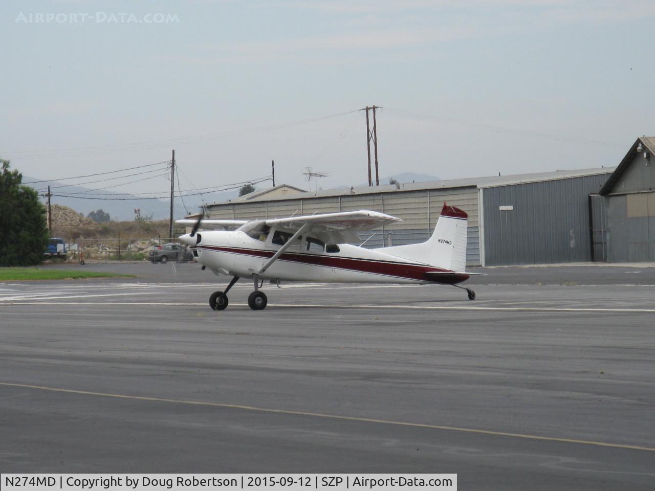 N274MD, 1975 Cessna 180J Skywagon C/N 18052591, 1975 Cessna 180J SKYWAGON, Continental O-470-S 230 Hp, taxi off the active after really short STOL flaps landing. See Rwy 22 numbers just to the left of aircraft. Impressive flying!