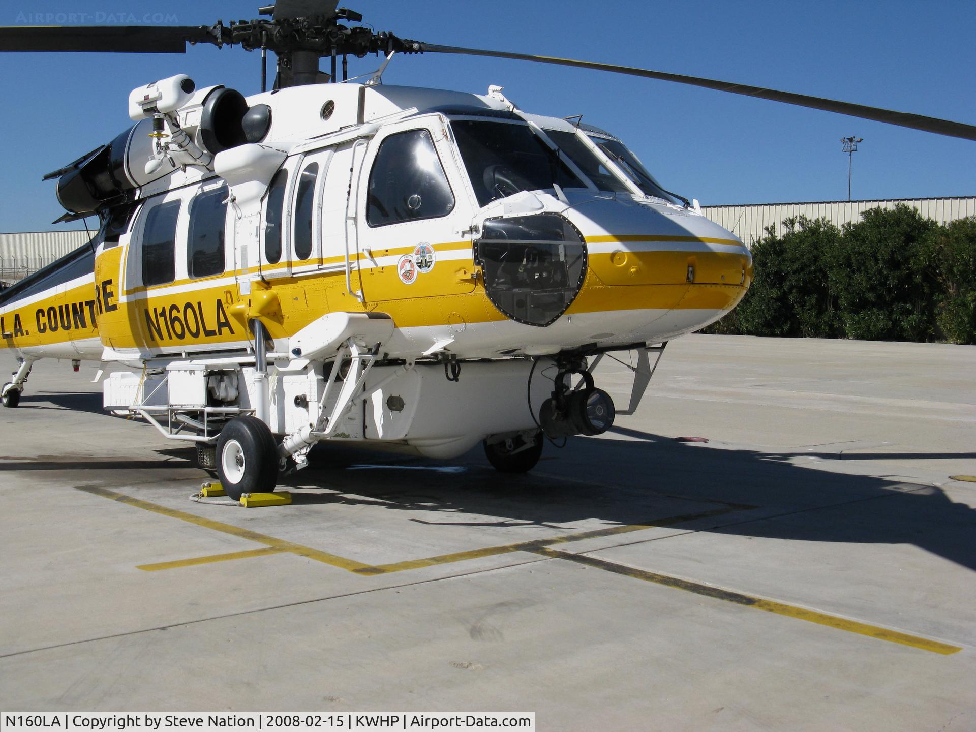N160LA, 2000 Sikorsky S-70A Firehawk C/N 702453, Close-Up Nose: Los Angeles County Fire 2000 Sikorsky S-70A Firehawk Helitanker #16 on ramp @ Whiteman Airport, Pacoima, CA home base