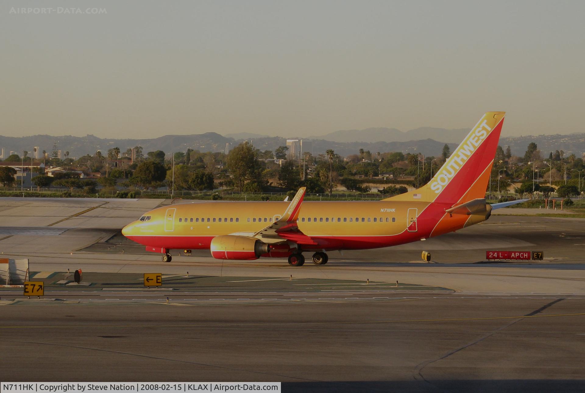 N711HK, 1998 Boeing 737-7H4 C/N 27845, Southwest Airlines 1998 Boeing 737-7H4 in old colors taxiing for takeoff @ Los Angeles International airport, CA