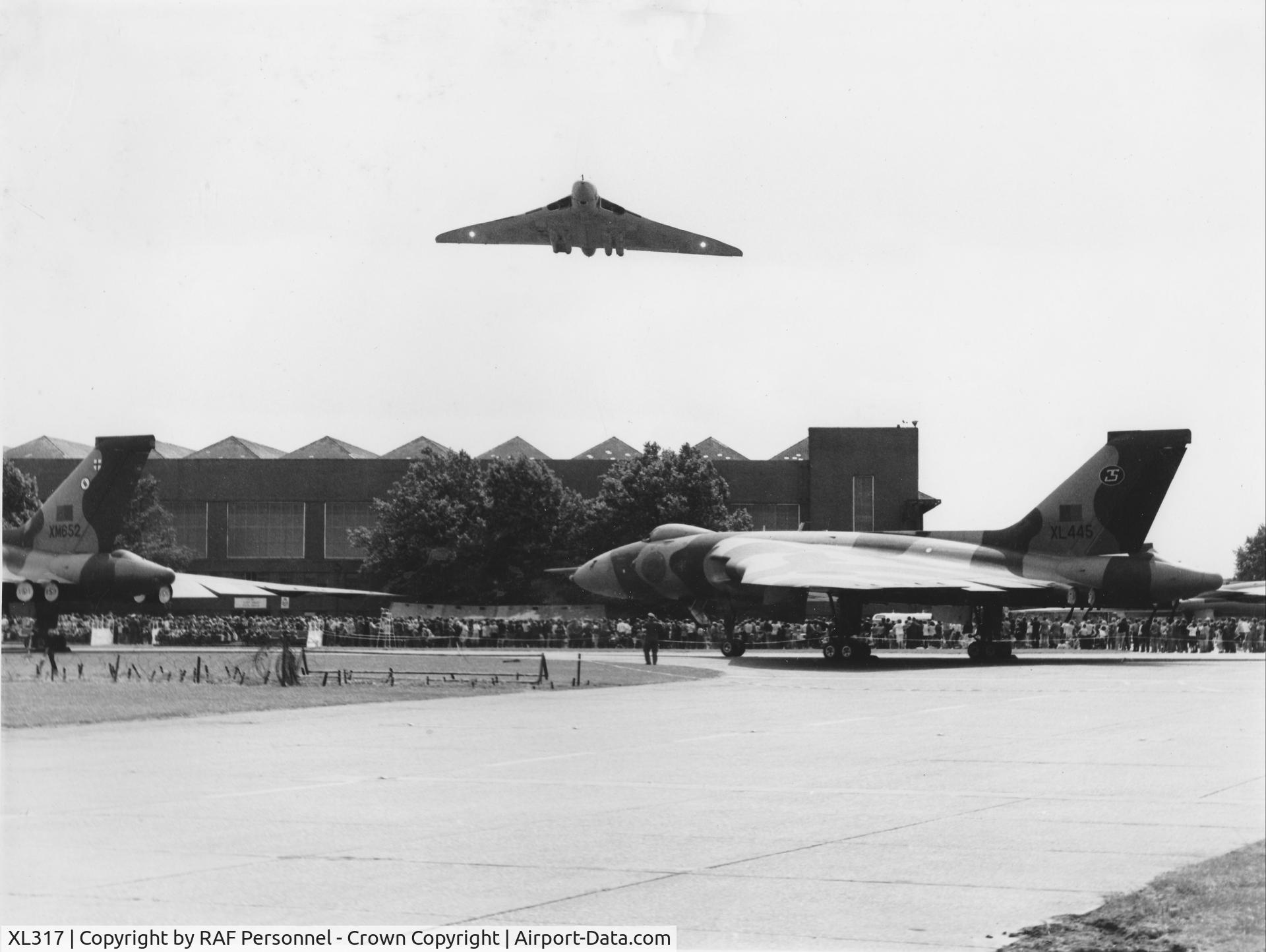 XL317, 1962 Avro Vulcan B.2 C/N Set 26, XL317 flying over standing  XL445 and XM652 at RAF Scampton Airshow, 1980.
