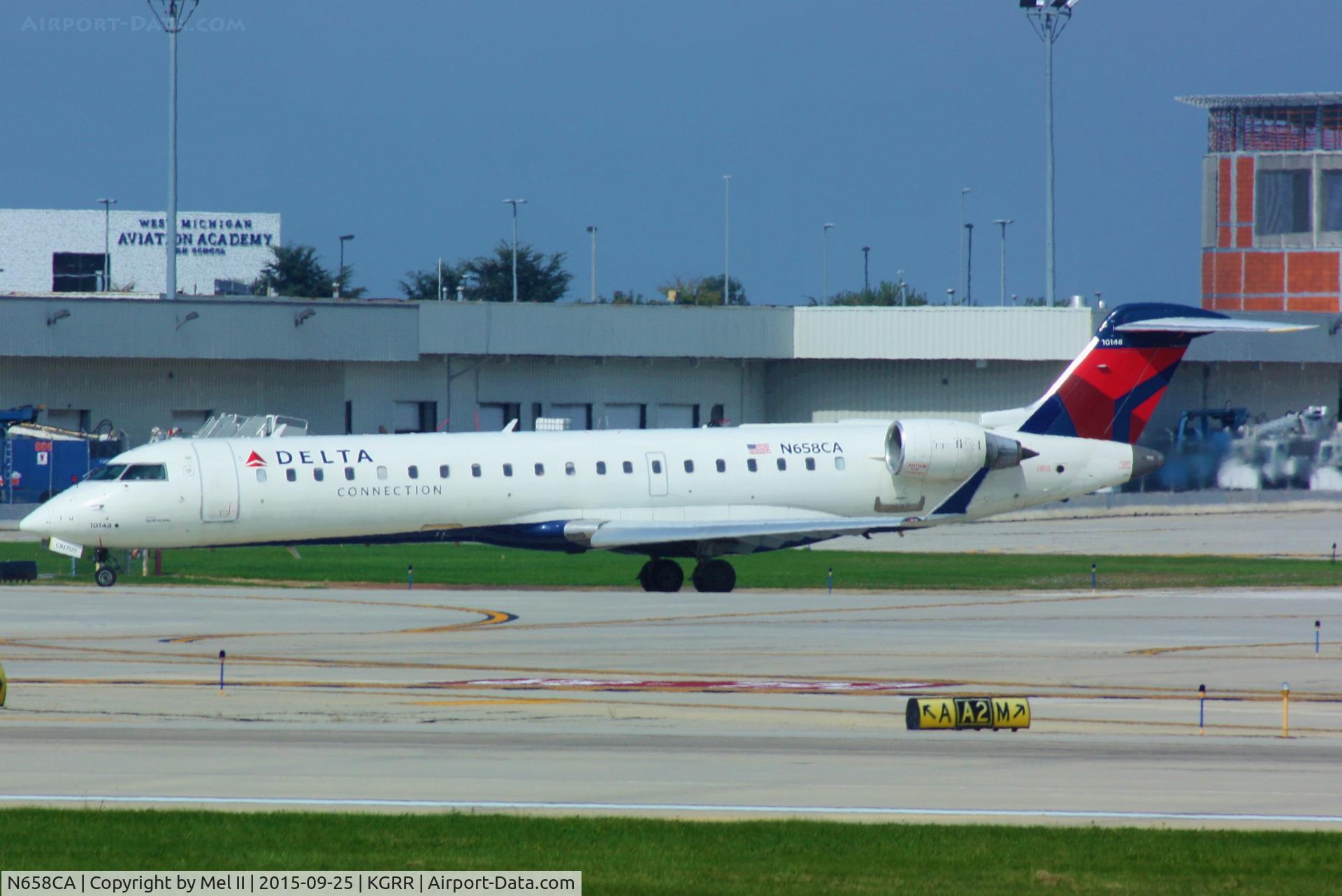 N658CA, 2004 Bombardier CRJ-700 (CL-600-2C10) Regional Jet C/N 10148, GJS6184 - KGRR-KLGA - Taxi For Departure RWY 8R