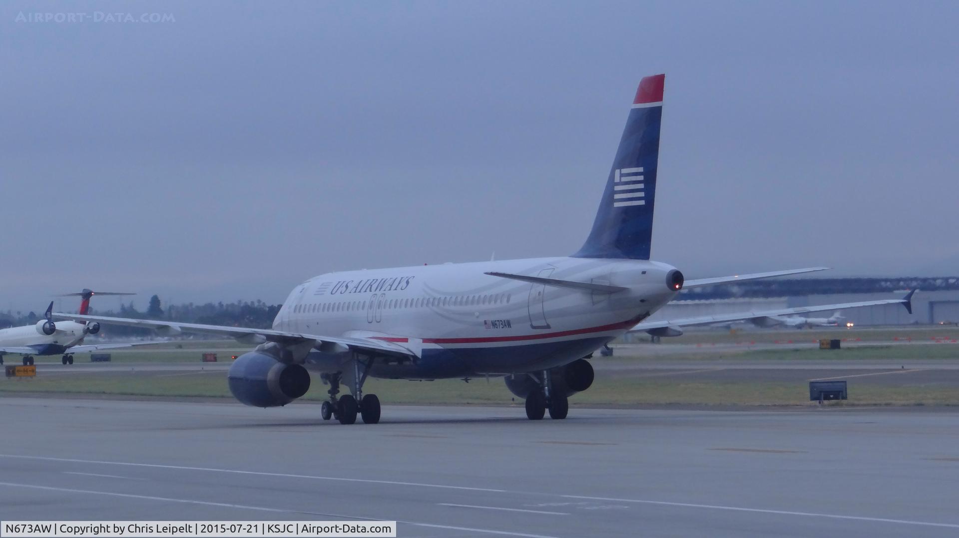 N673AW, 2004 Airbus A320-232 C/N 2312, US Airways 2004 Airbus A320 taxing out for an early morning departure at San Jose International Airport, San Jose, CA.