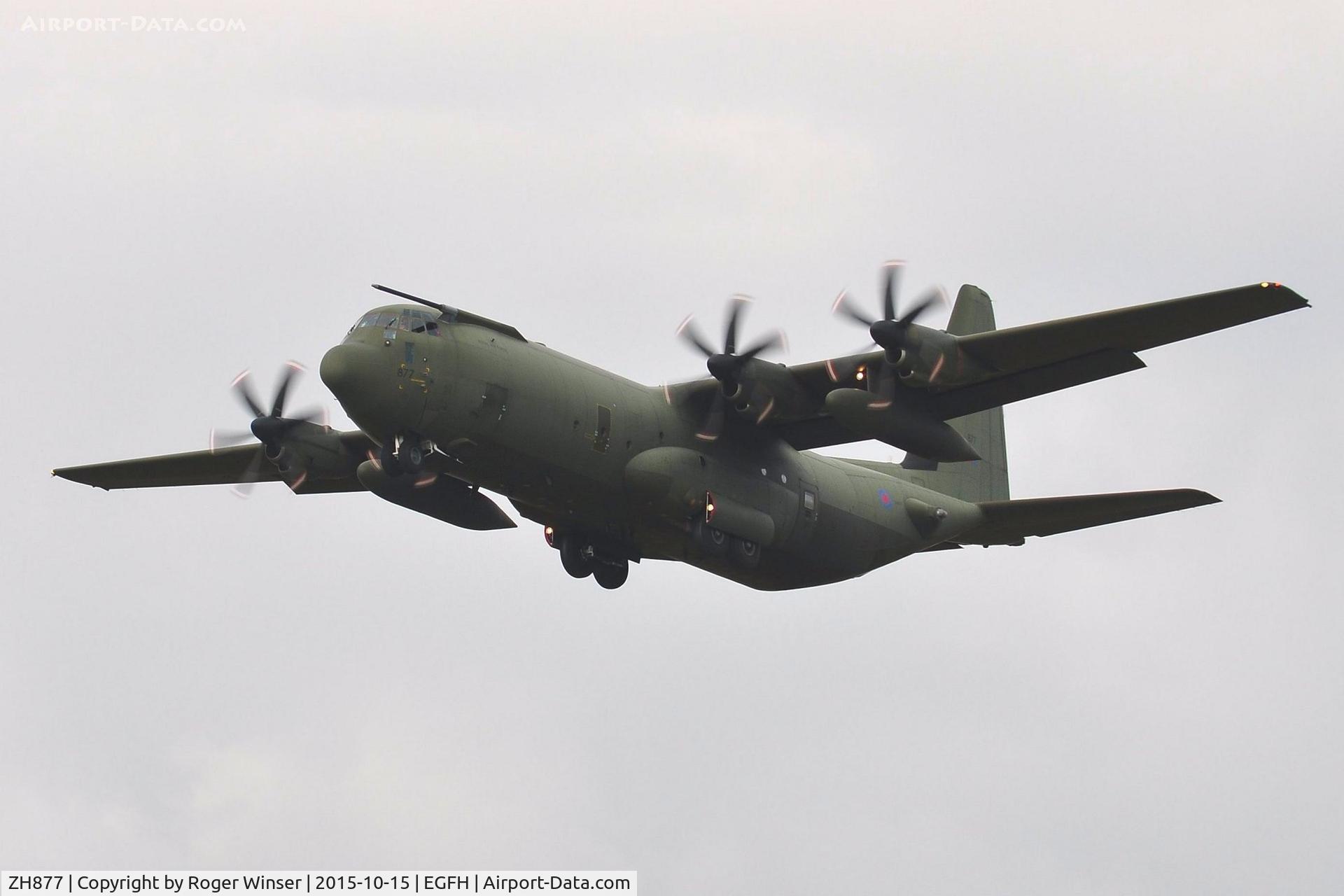 ZH877, 1998 Lockheed Martin C-130J-30 Hercules C.4 C/N 382-5461, RAF Hercules C.4 aircraft coded 877 of the Brize Norton Transport Wing makes a low pass over Runway 22.